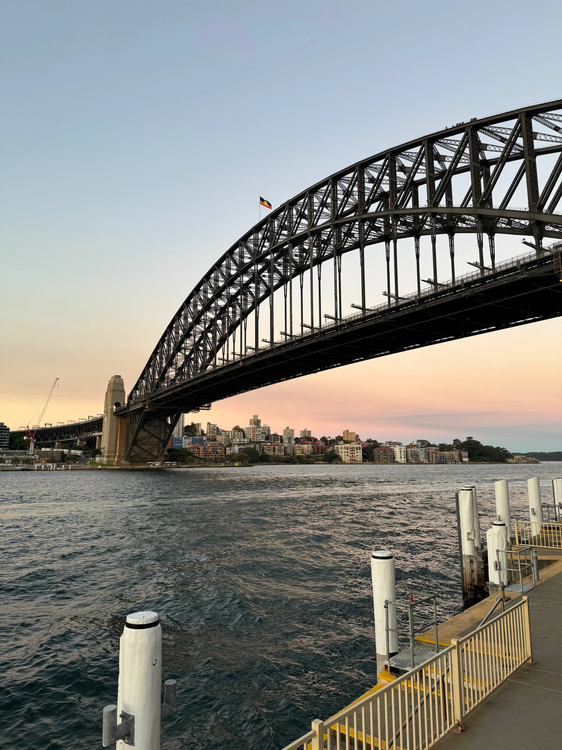 The Harbour Bridge against the evening sky.