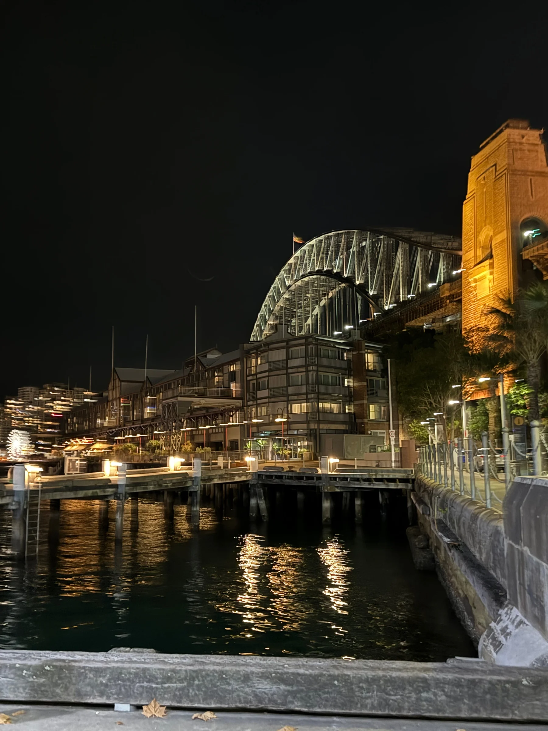 The illuminated bridge and the water.