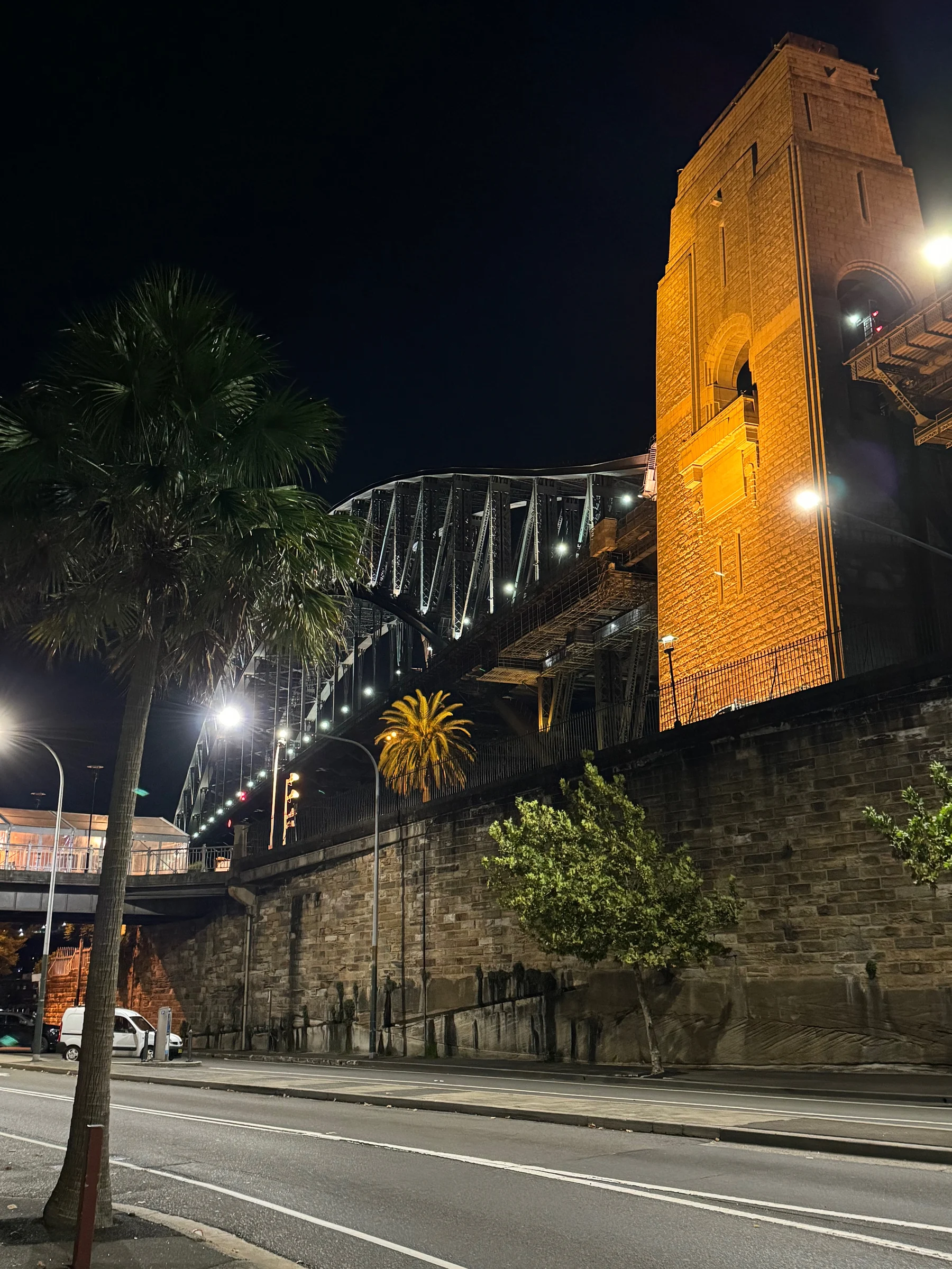 A walk beneath the bridge at night.