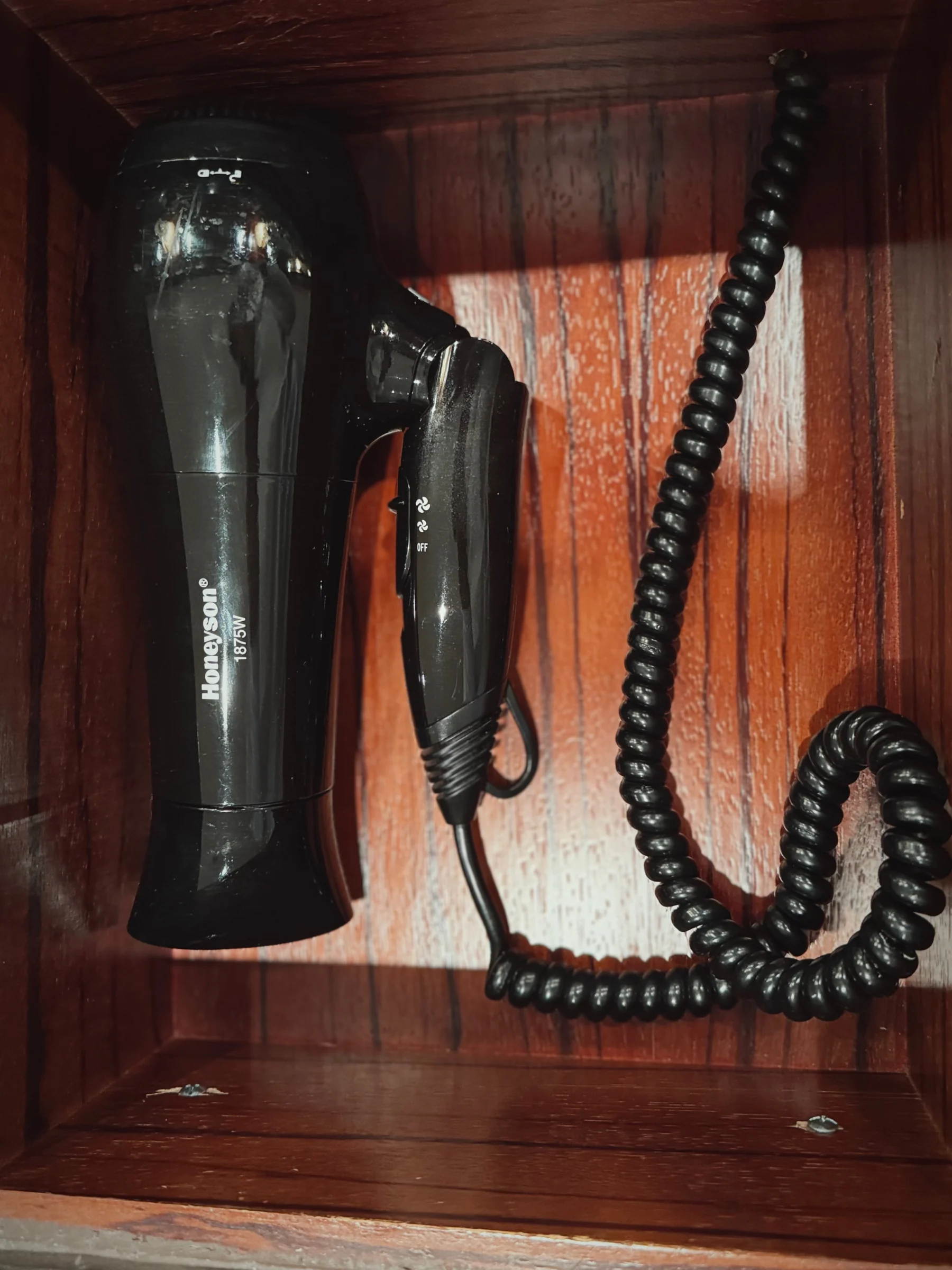 The hair dryer fitted in a drawer