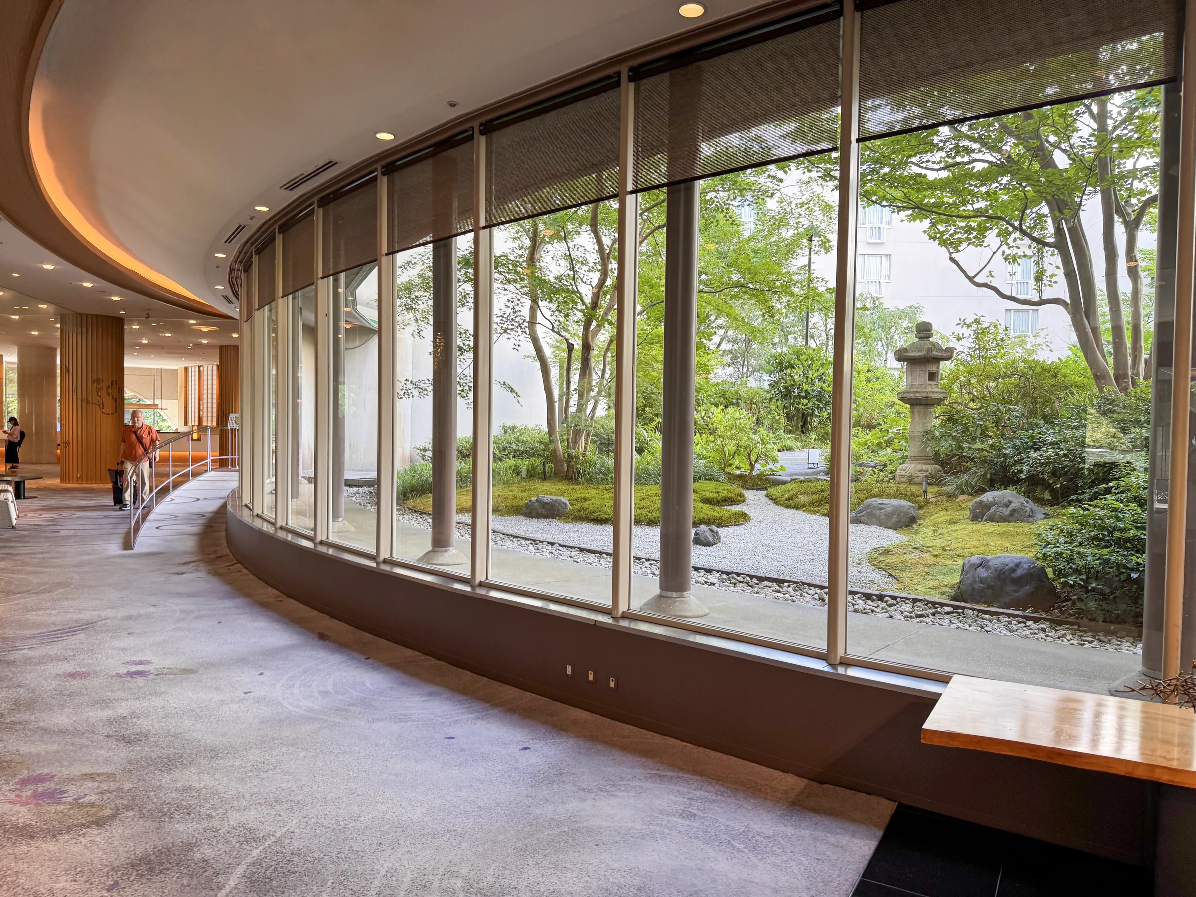 A curved corridor facing the garden.