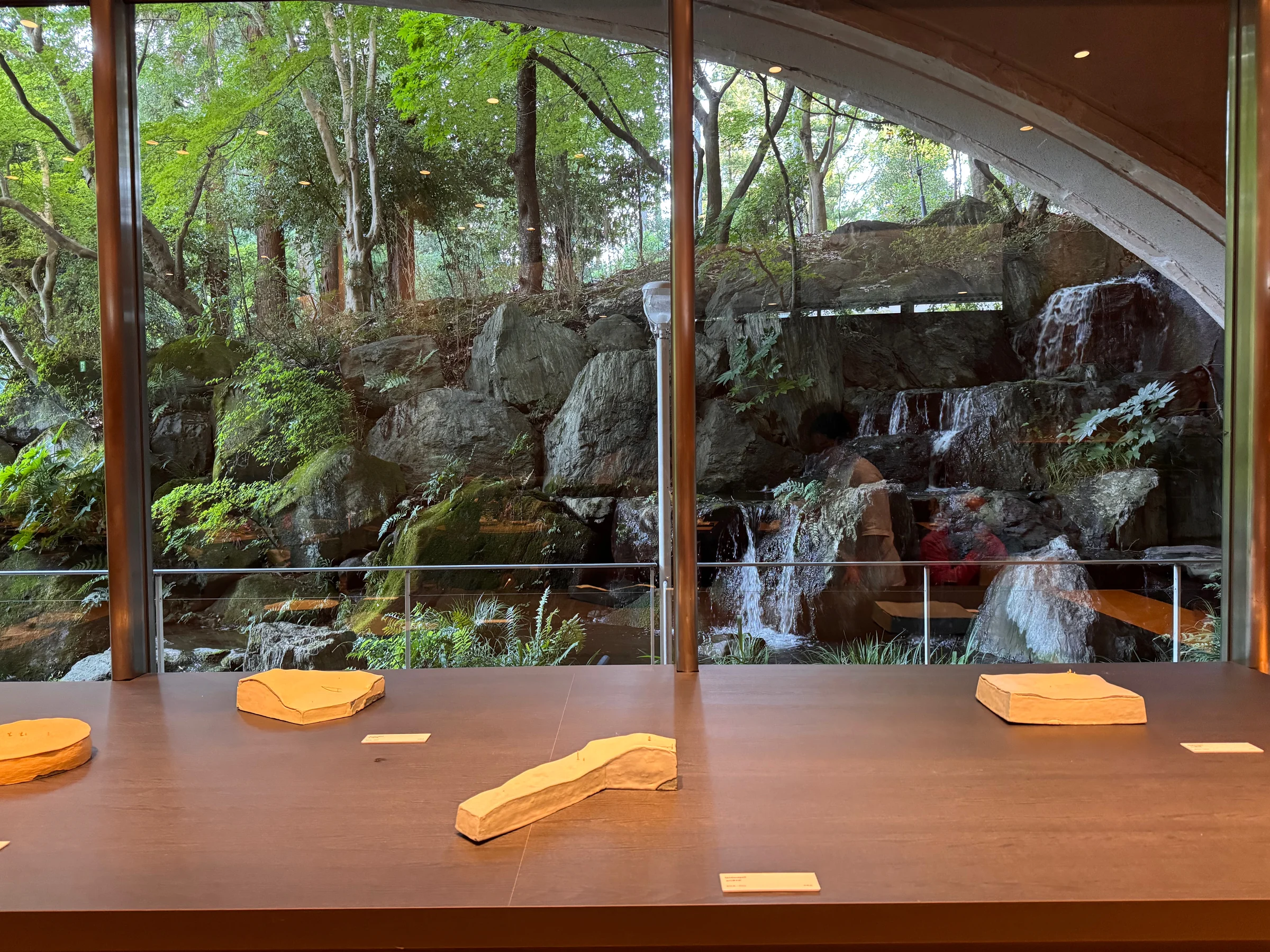Counter seats overlooking the garden through the windows.