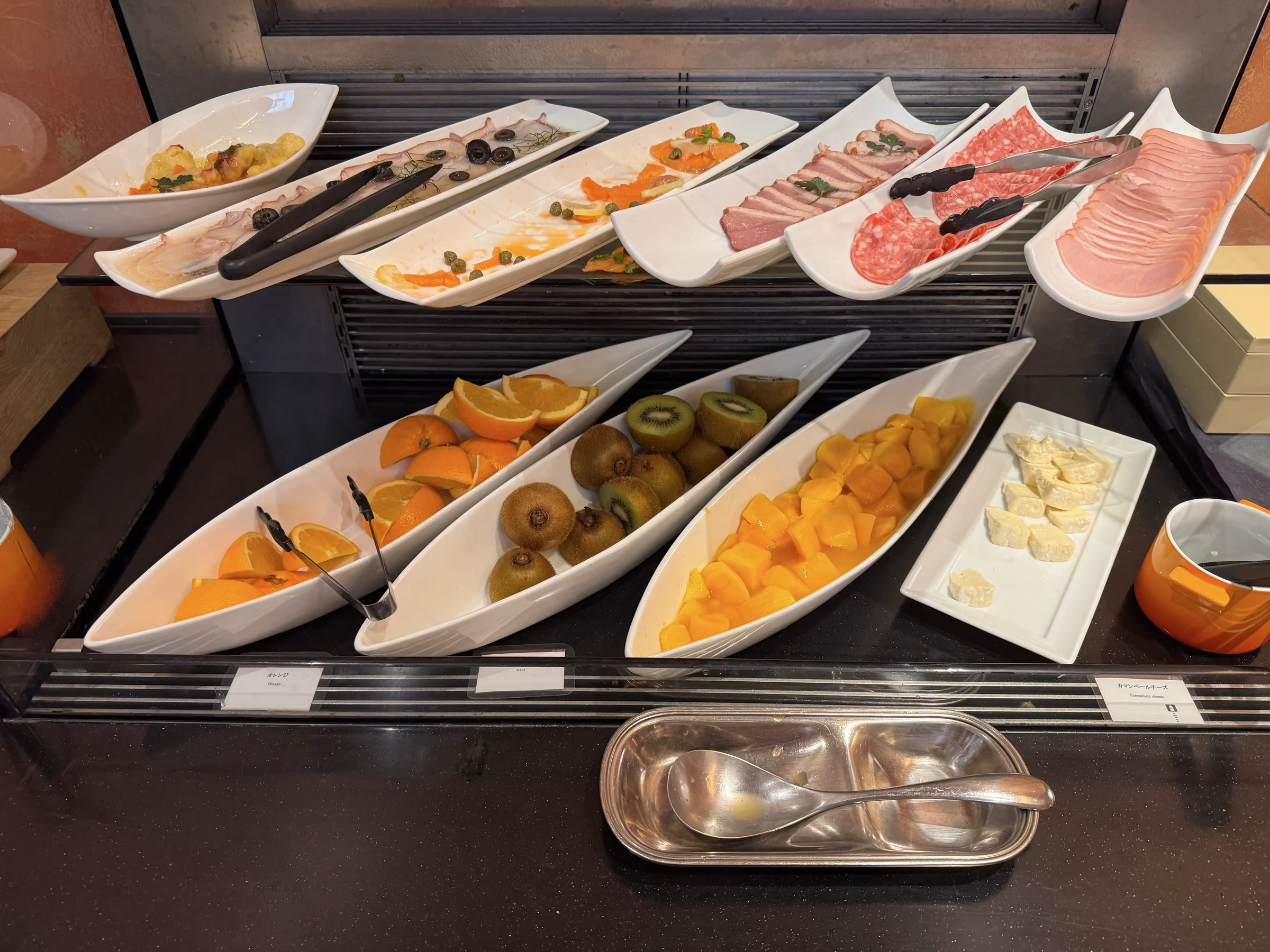 Salads and ham at the breakfast buffet.
