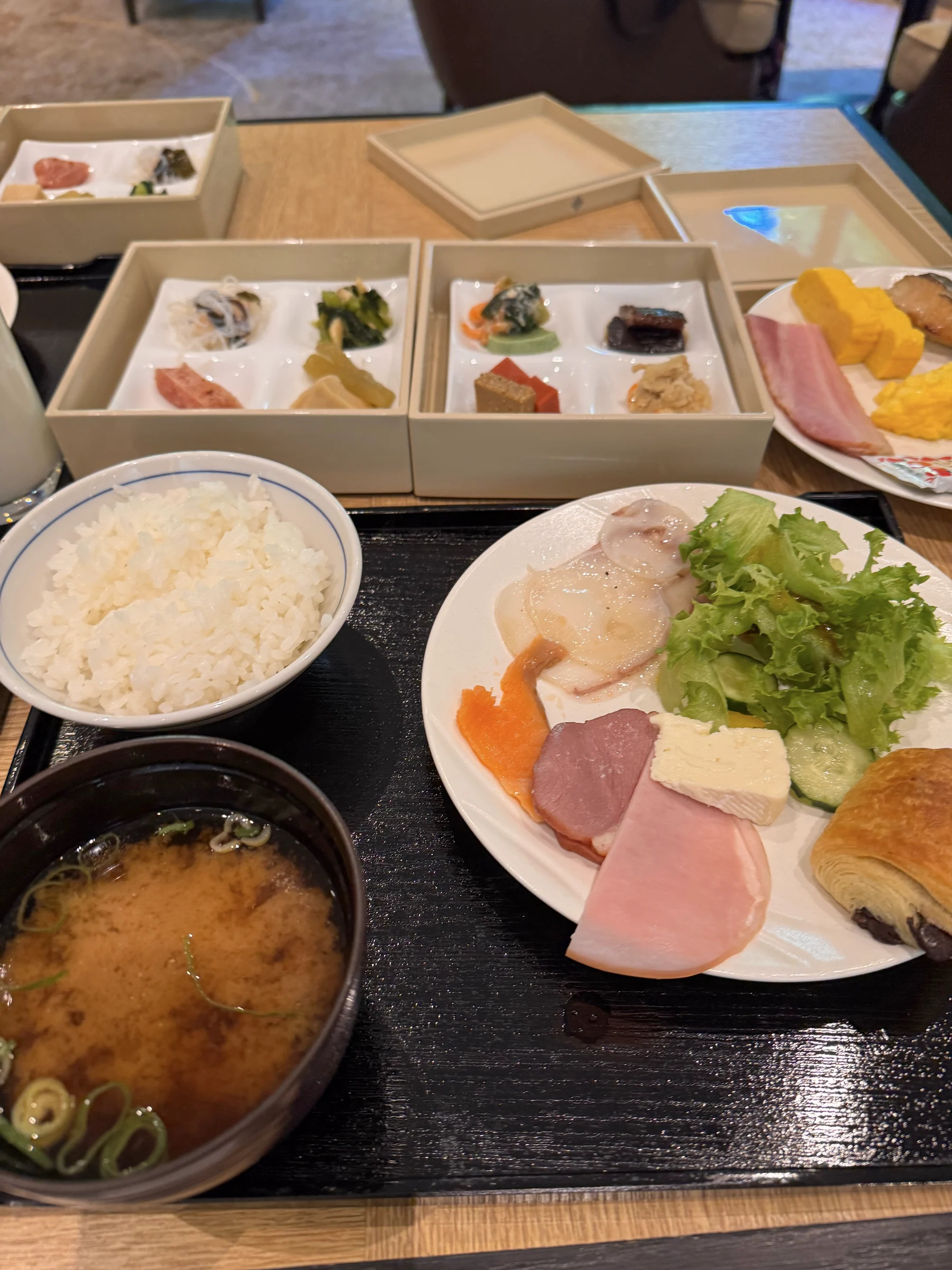 Rice, miso soup and a plate of side dishes.