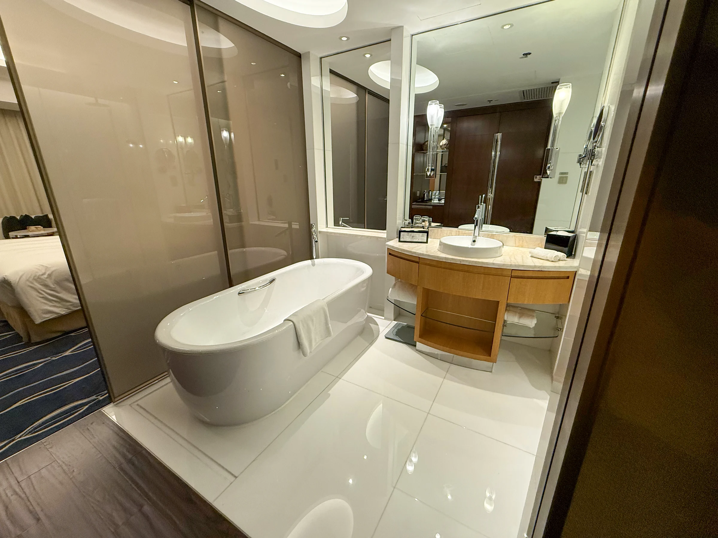 The separate bathtub and washbasin.