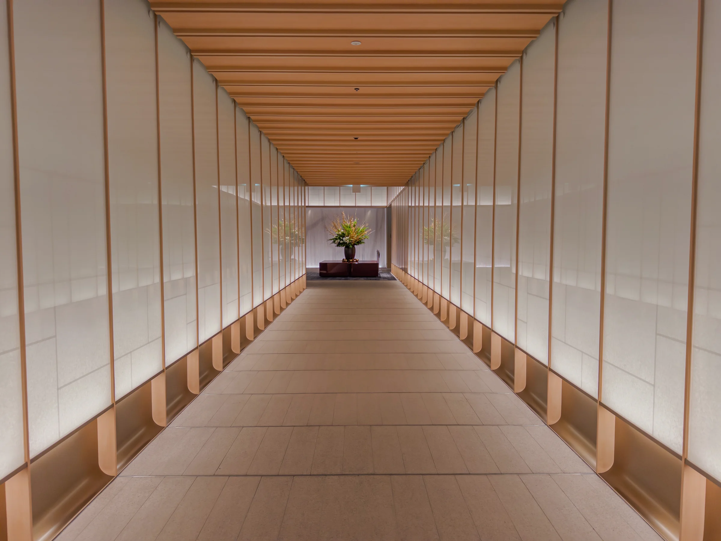 A long corridor filled with natural light