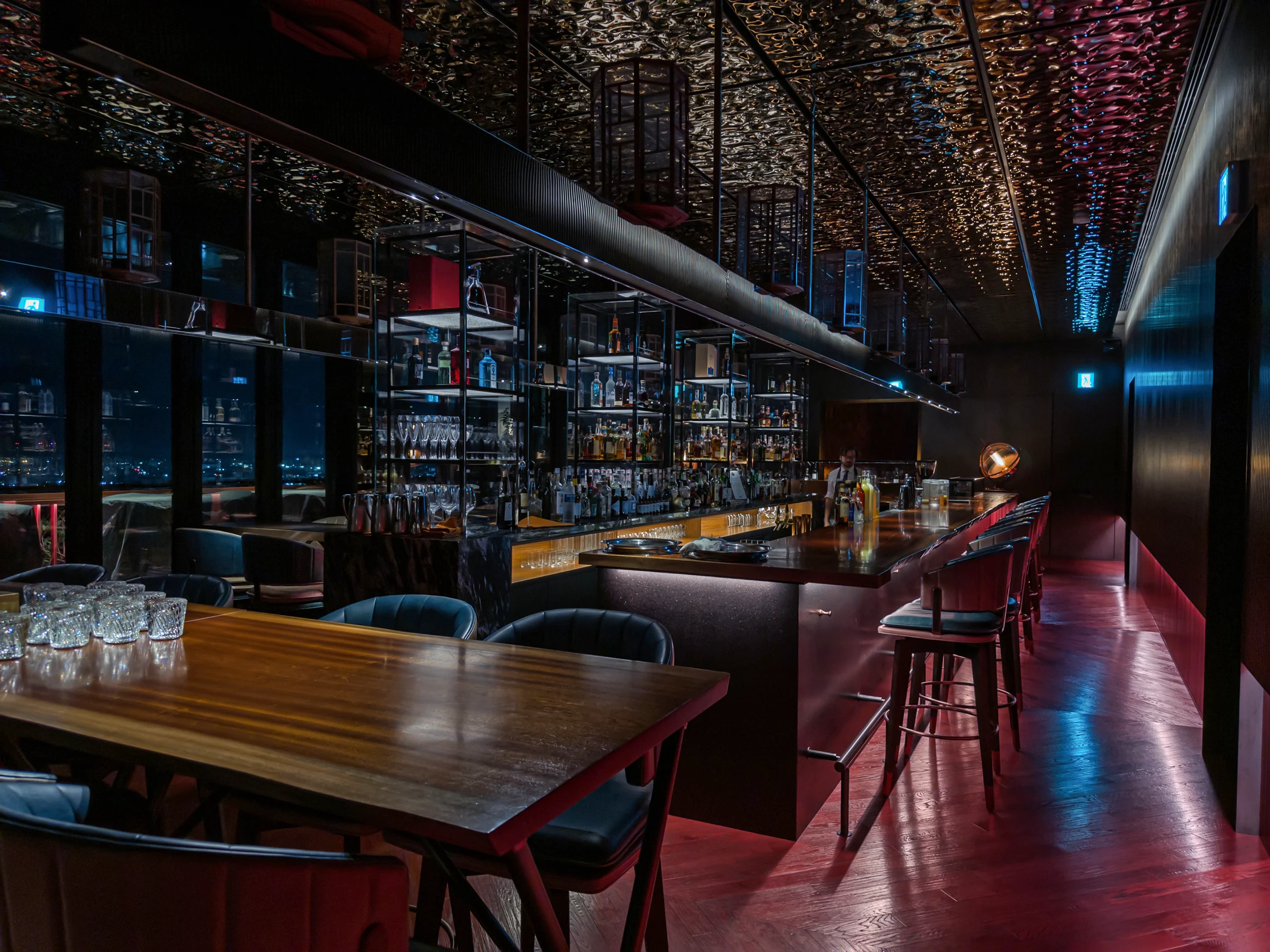 The bar counter and tables in the evening
