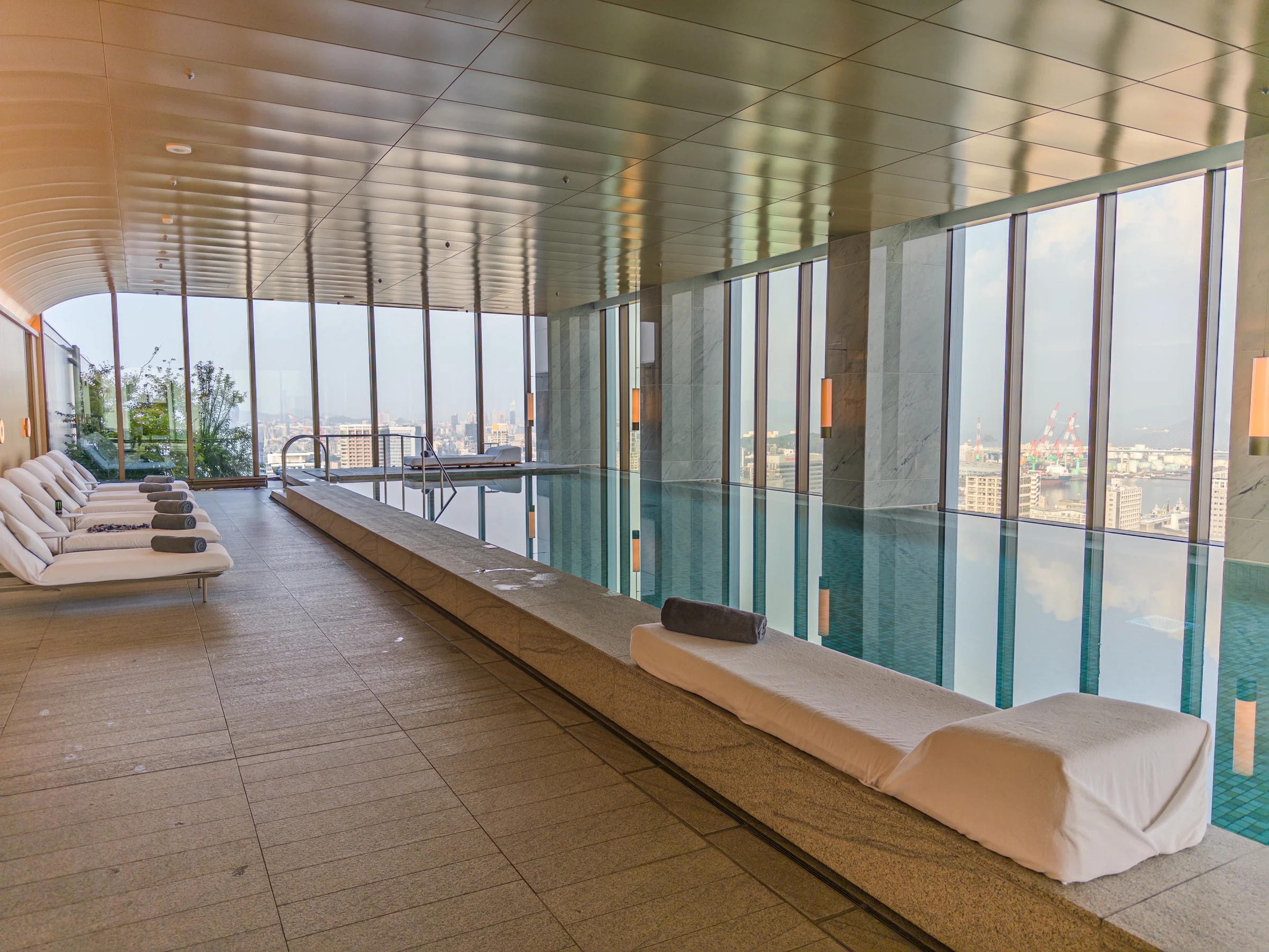 Poolside seating along the windows