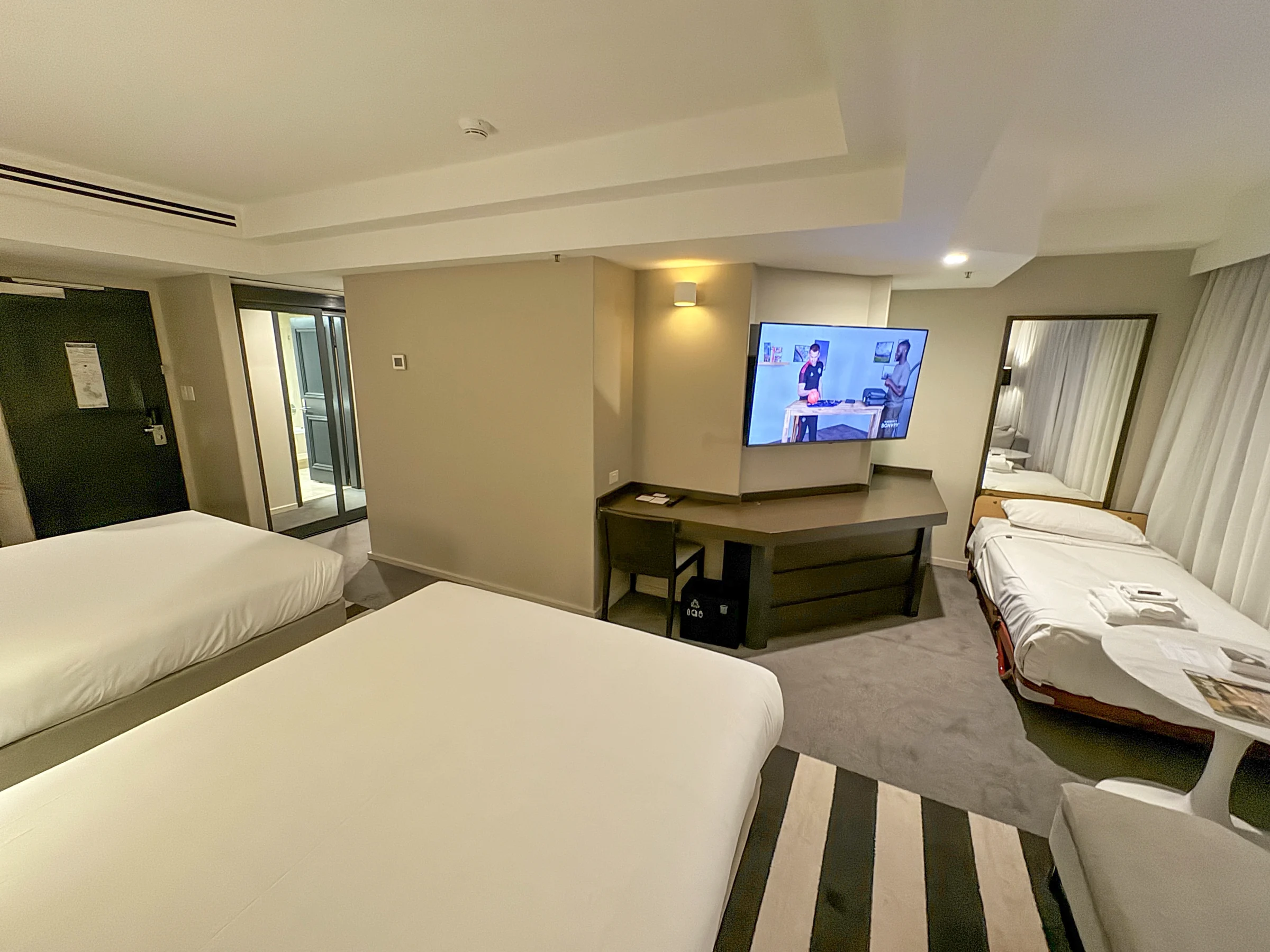 The extra bed added for three guests.
