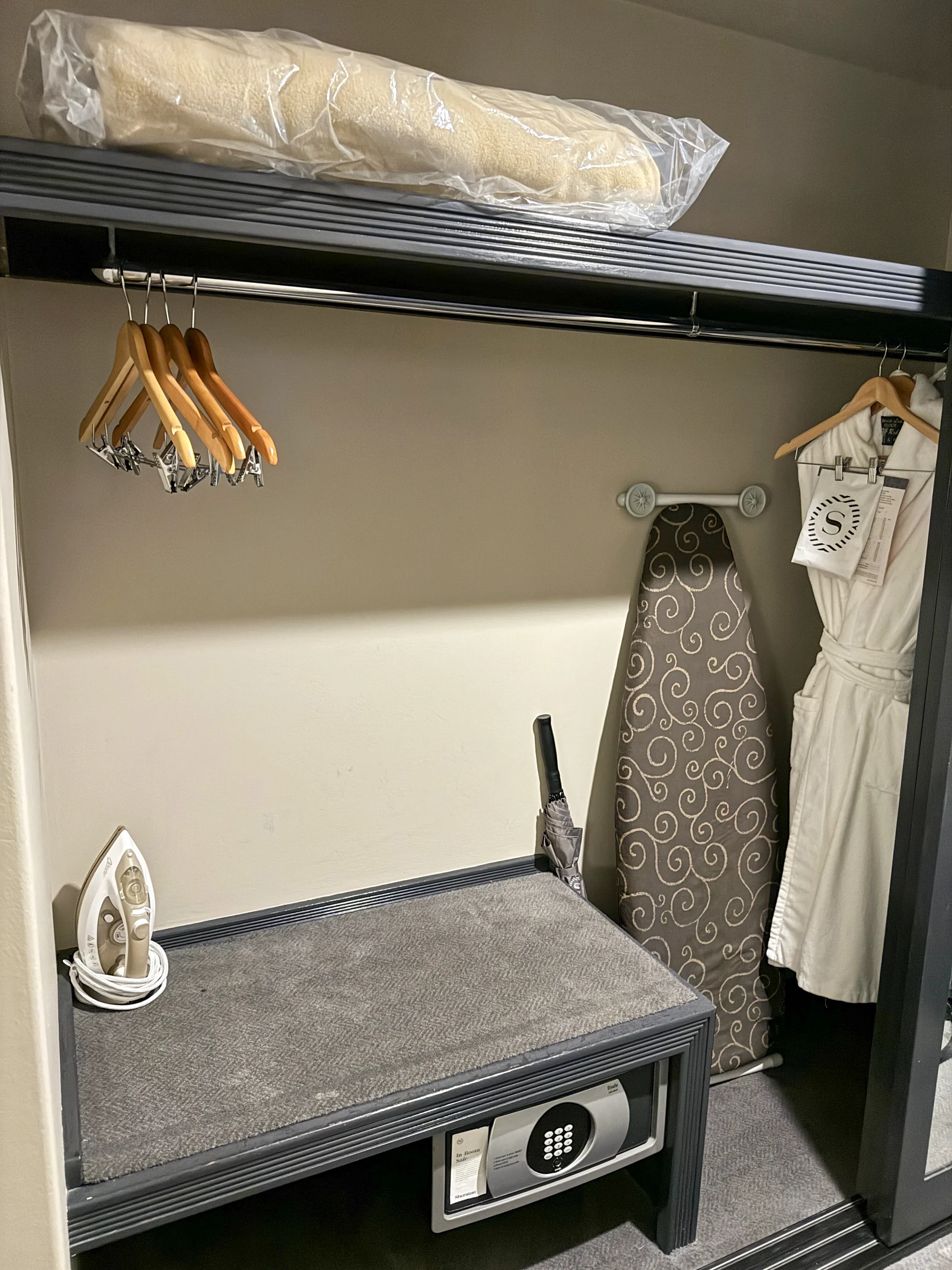 The wardrobe and ironing board.