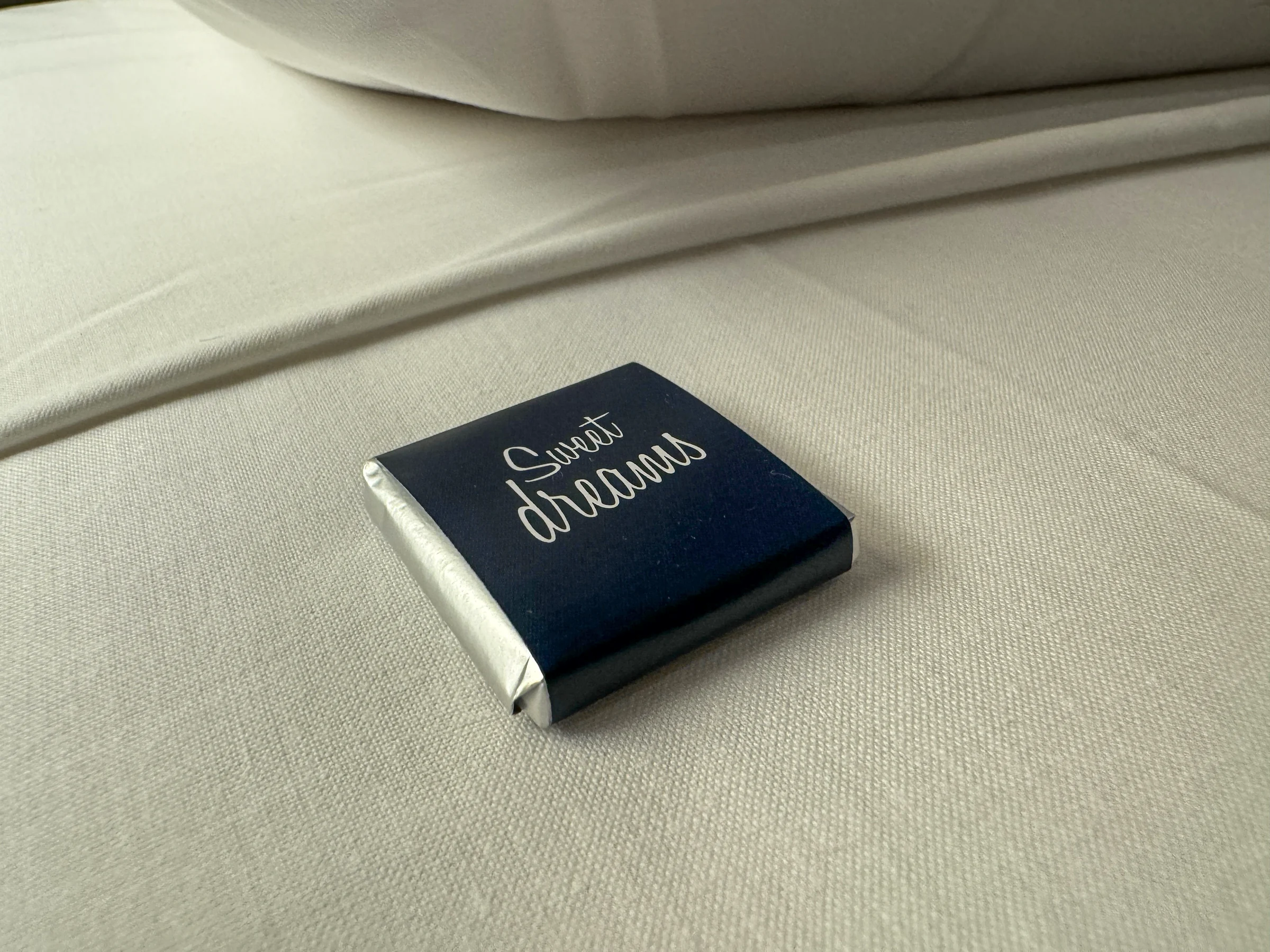 Small chocolates by the pillows.