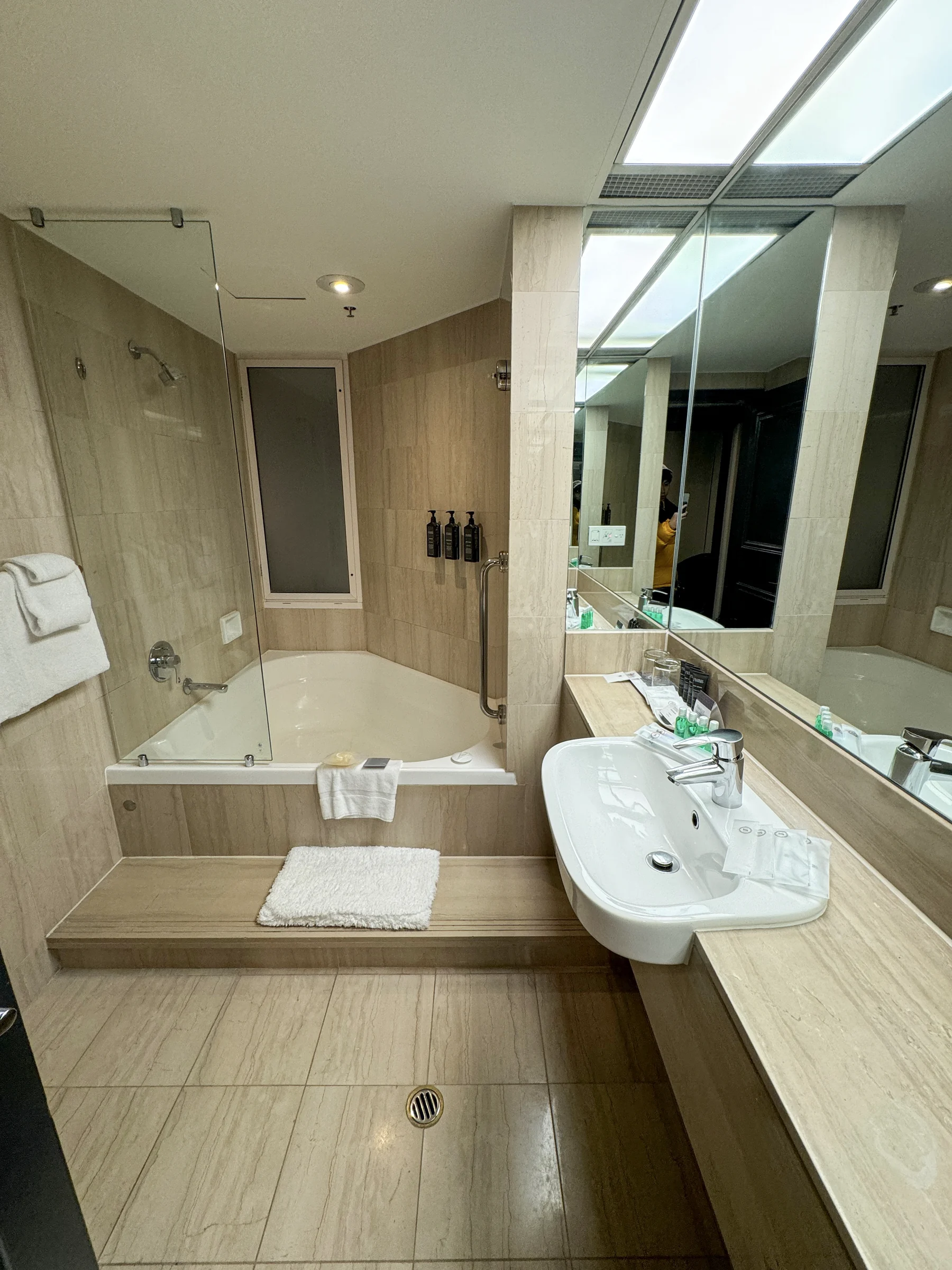 The bathroom with stone-effect walls.