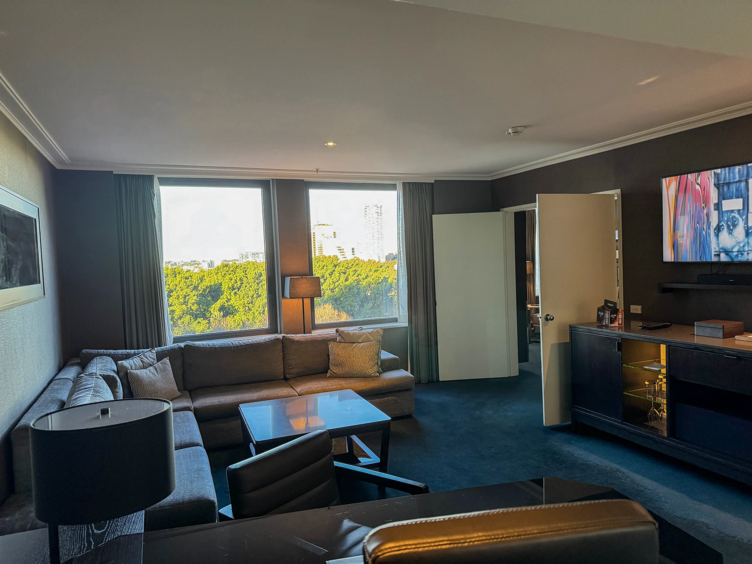 A separate living room with a sofa and television.