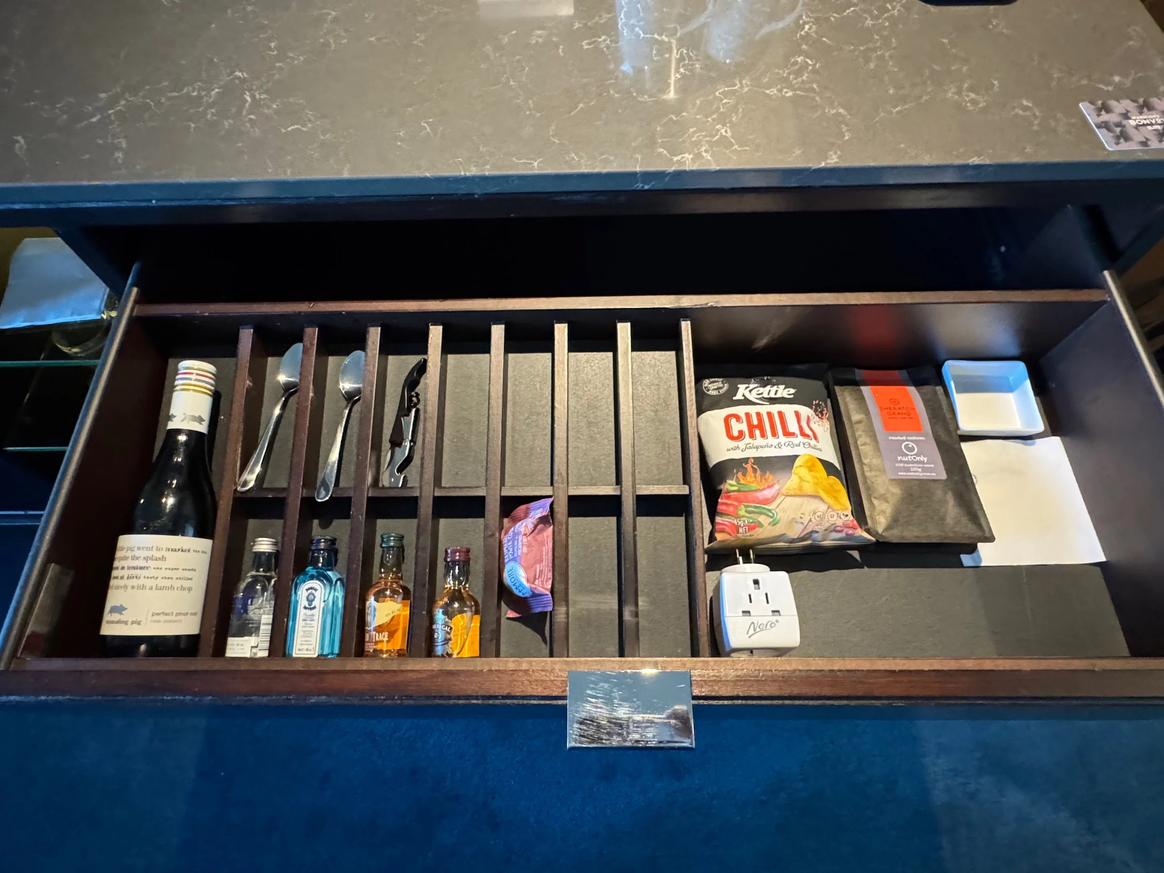 Minibar items in a drawer.