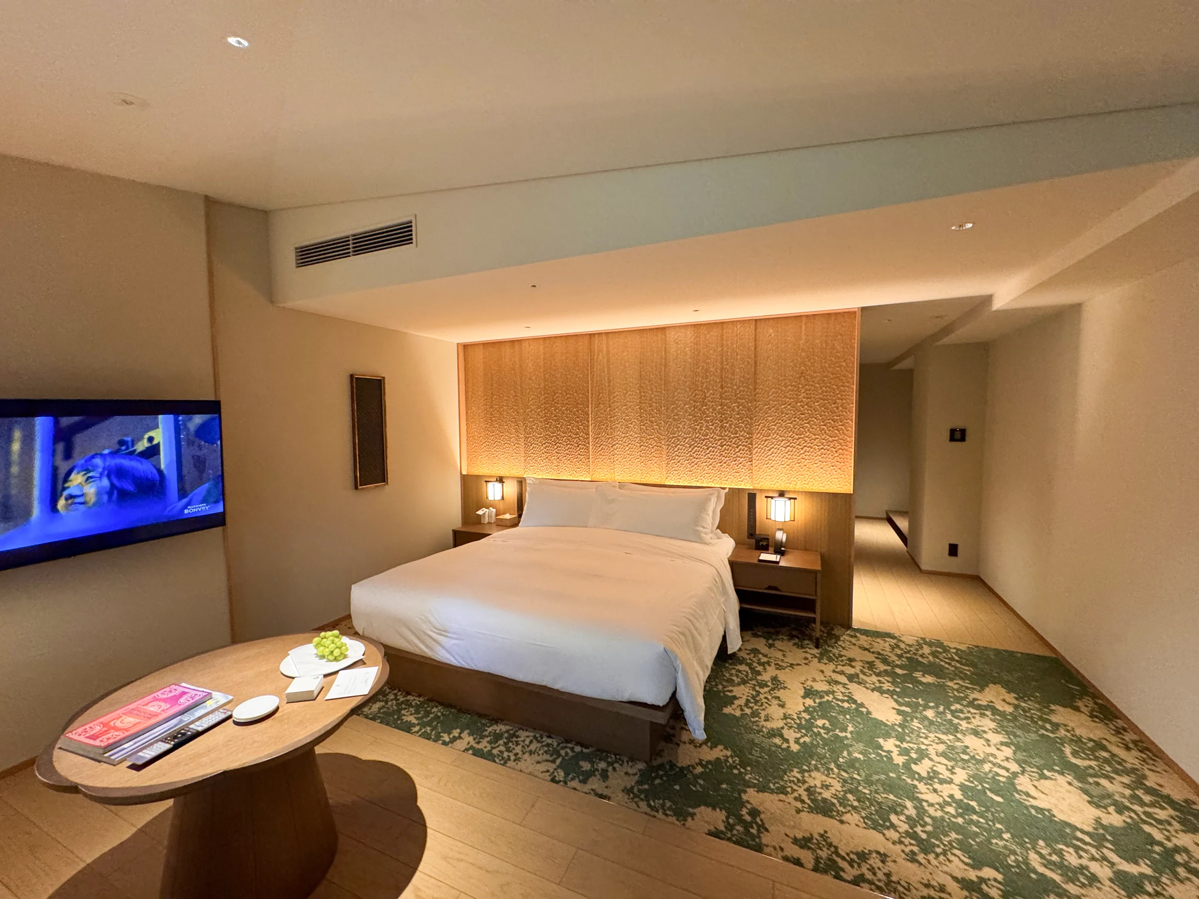 A spacious room in calming wood tones.
