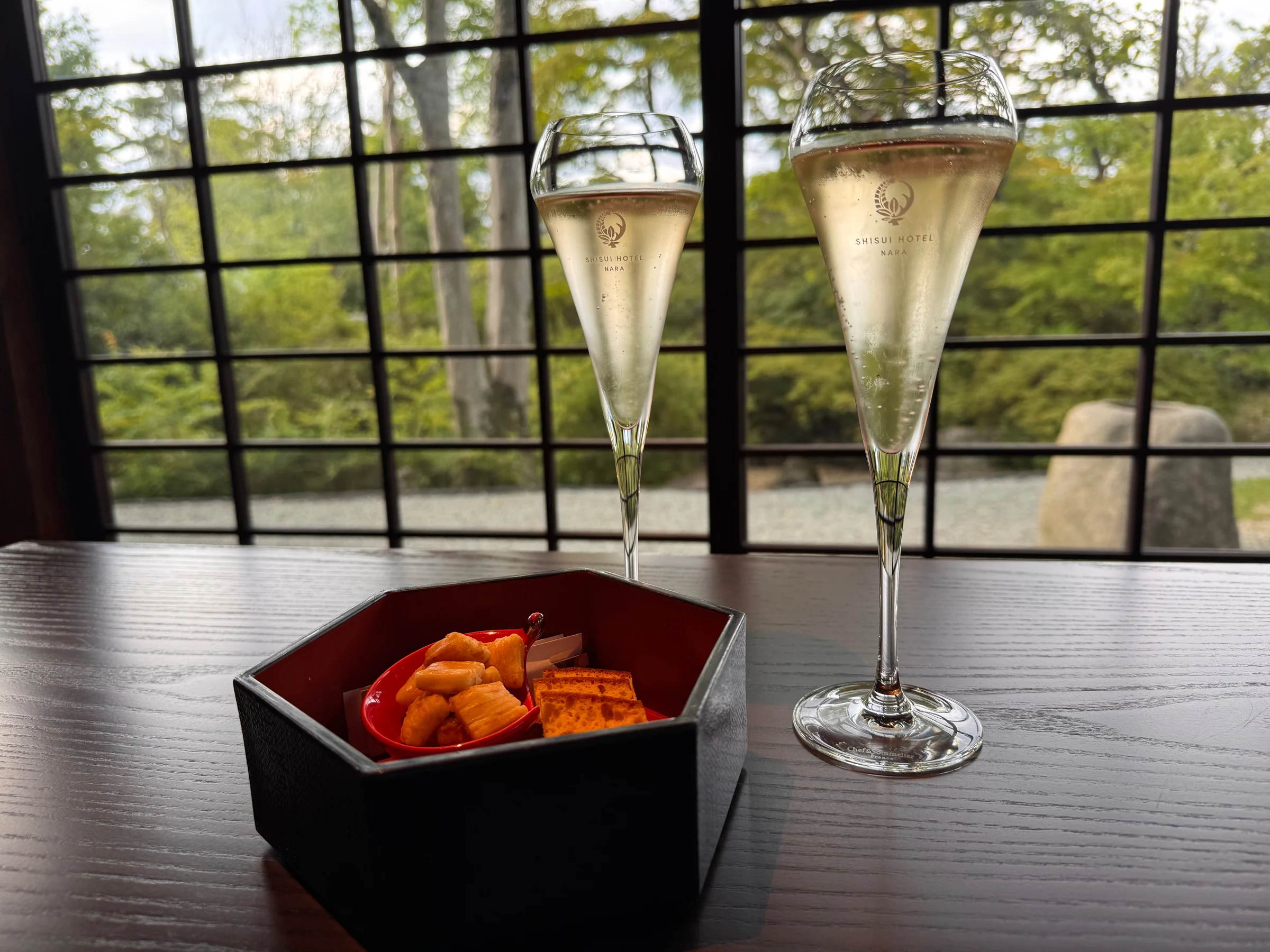 Champagne and rice crackers at Garden Delight.