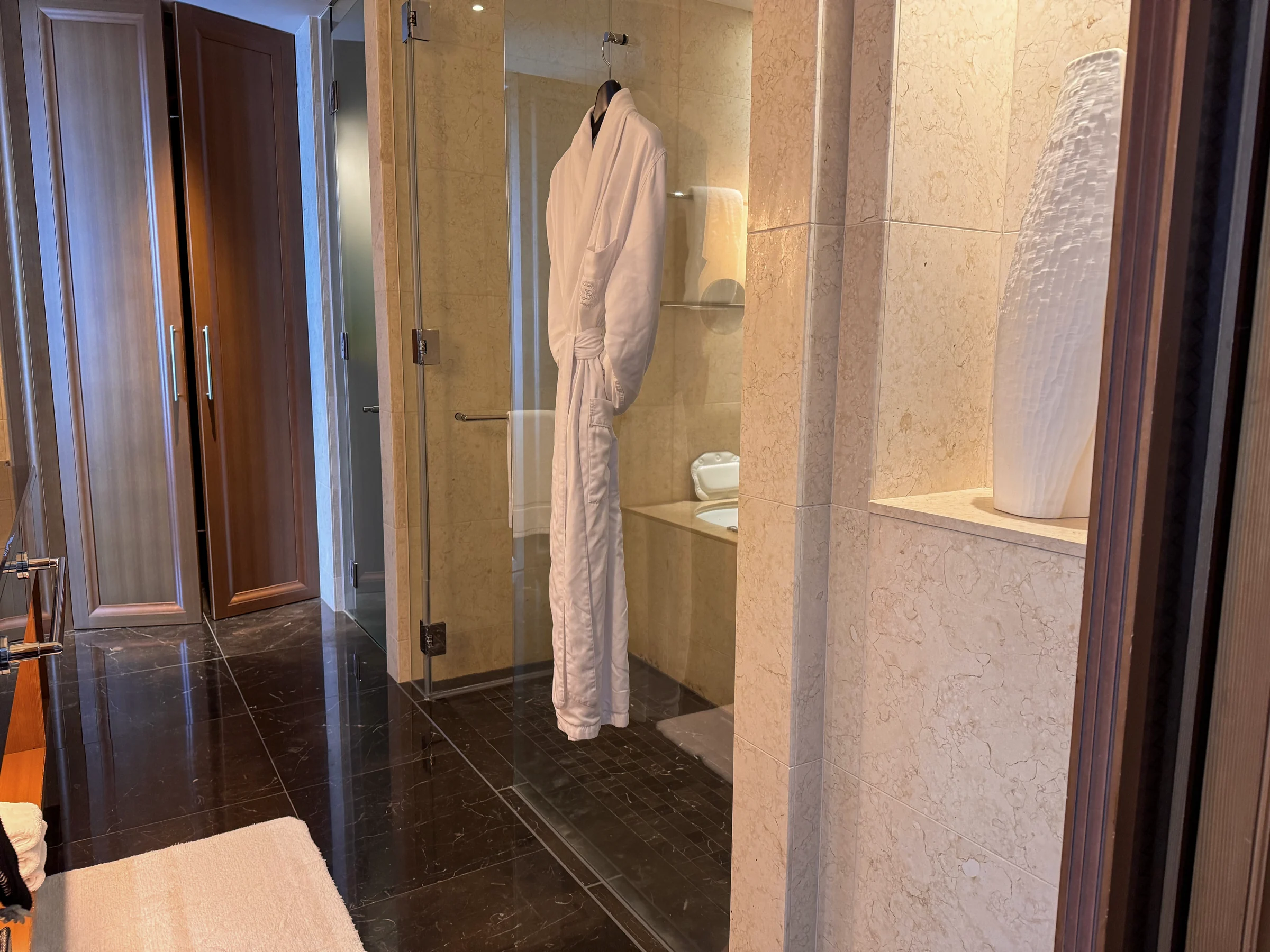 Marble flooring in the spacious bathroom.