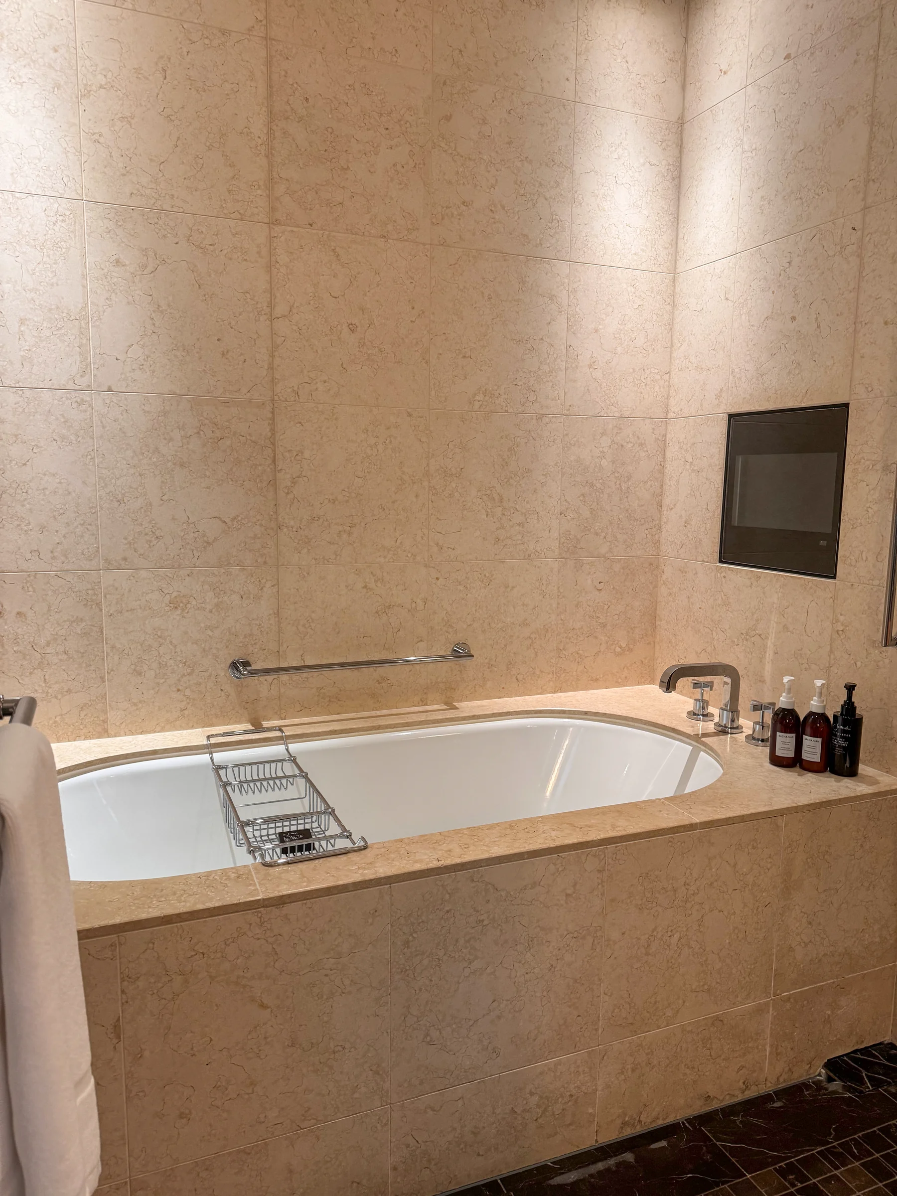 A bathtub to stretch out in, with a bath television.