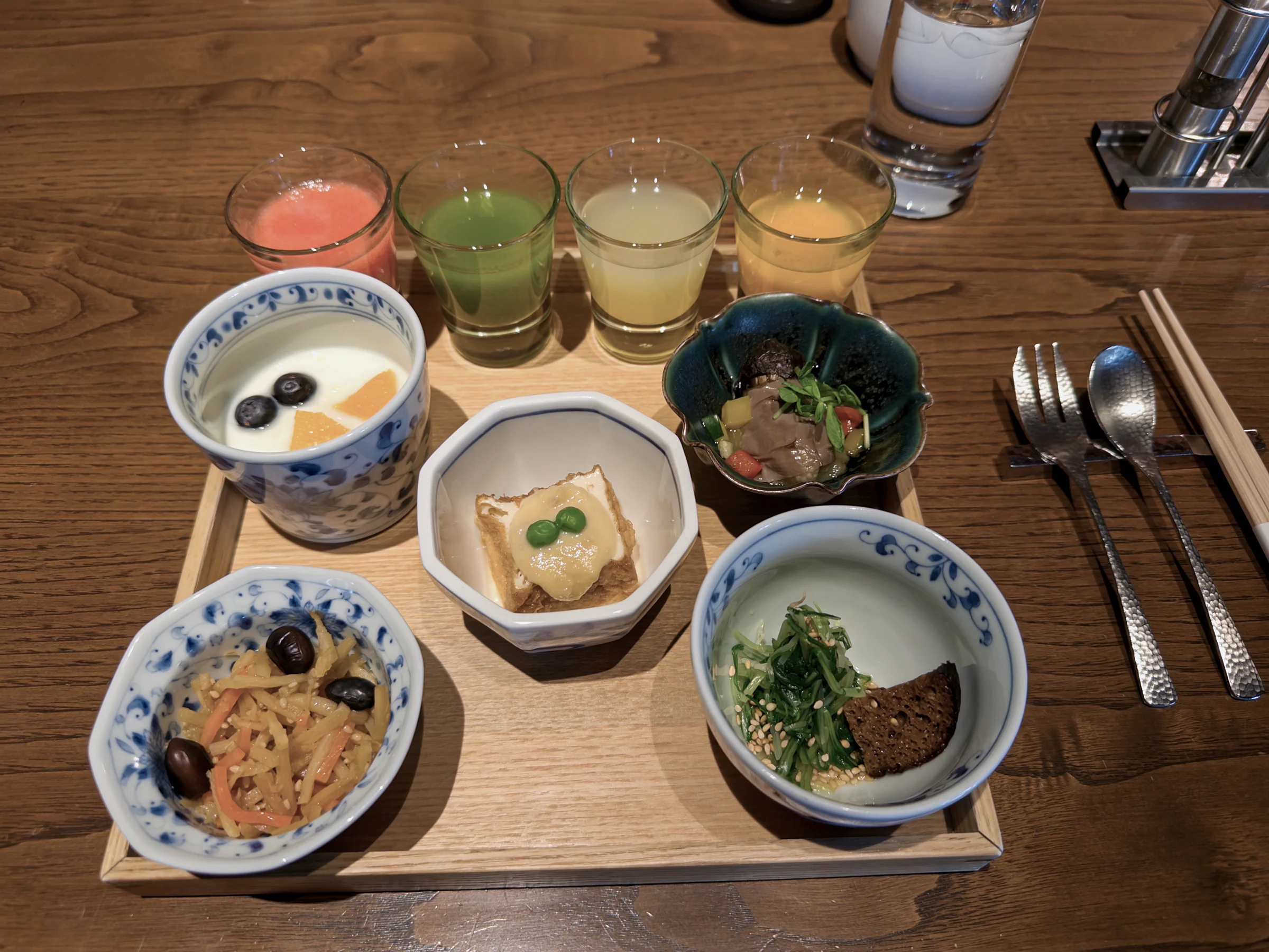 Small Japanese breakfast dishes and juice
