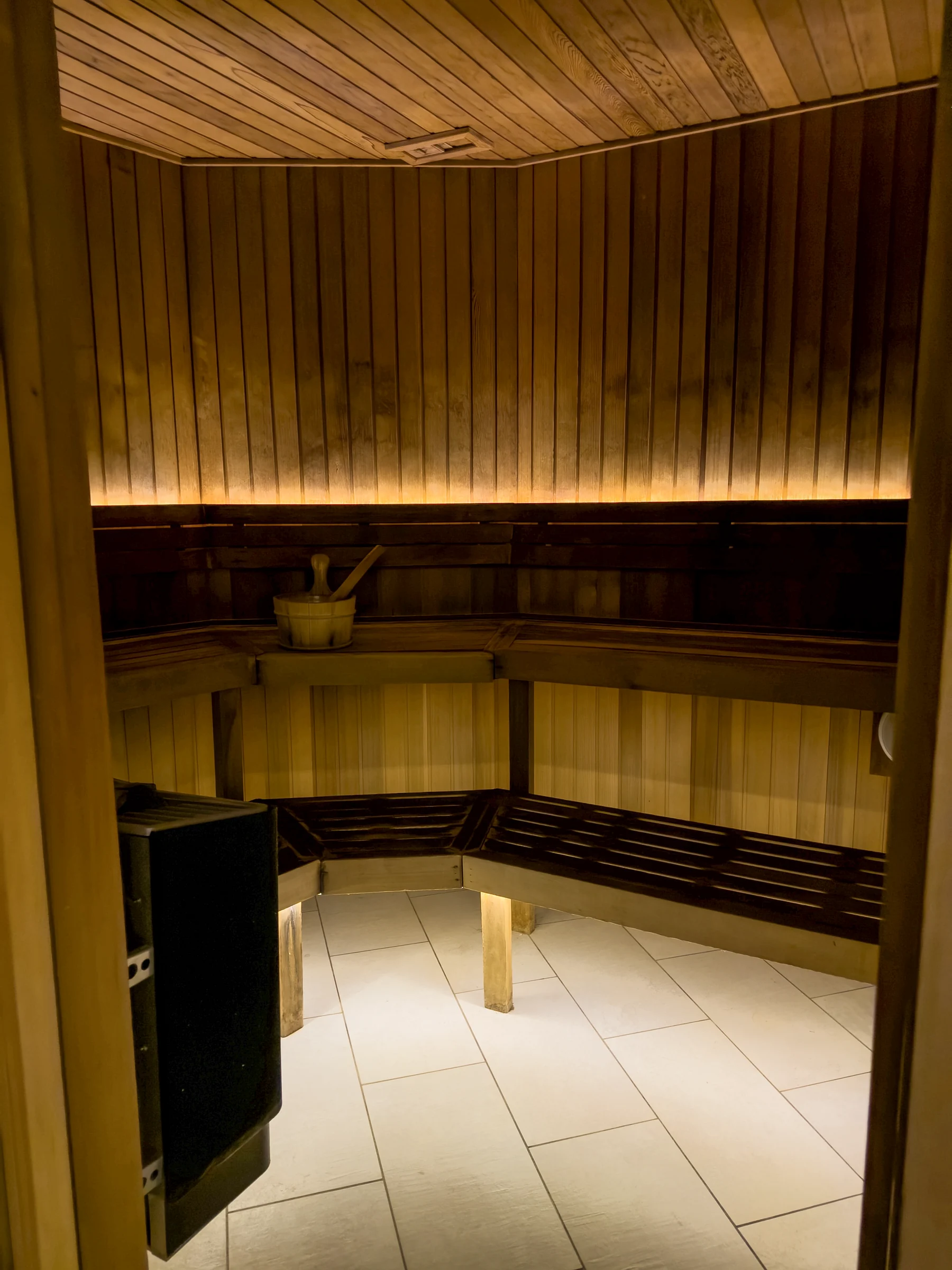 The warmly lit sauna.