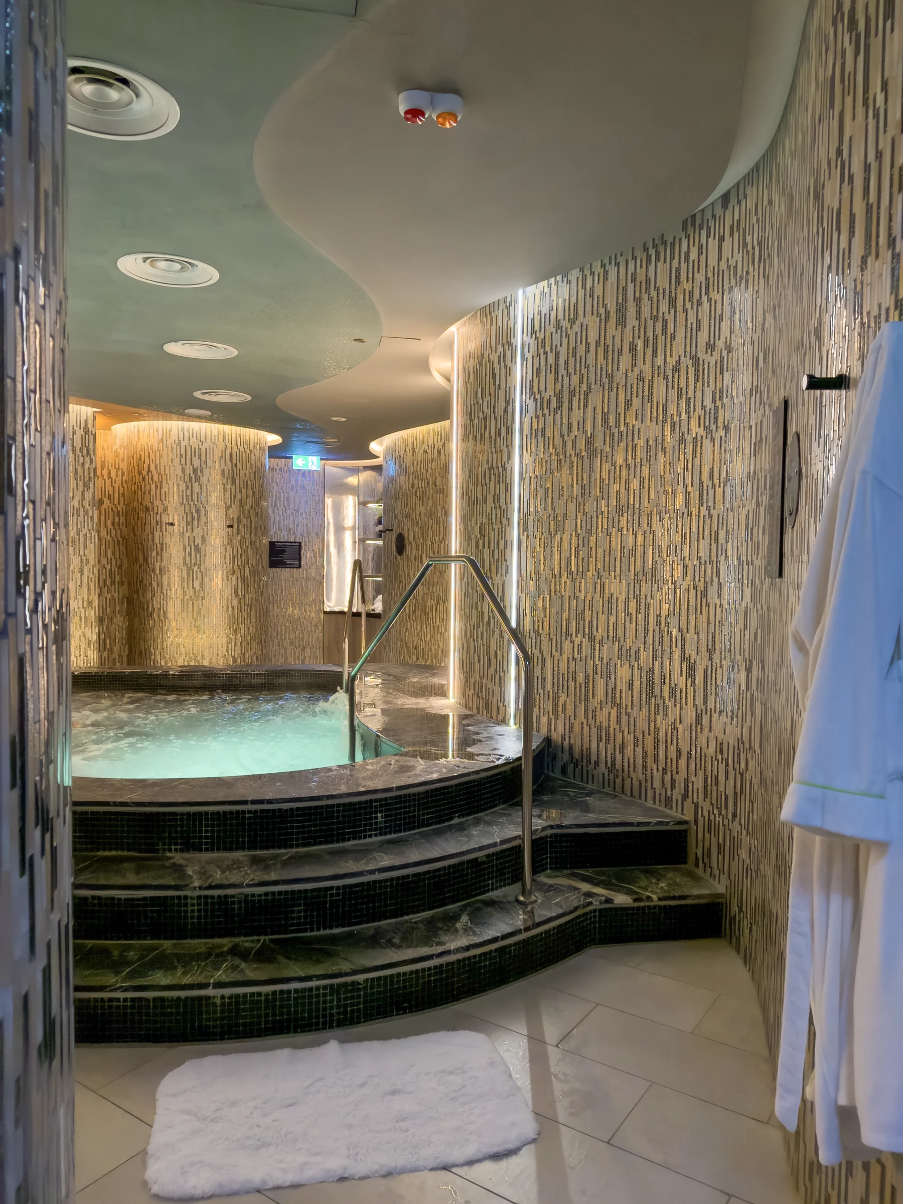 Stone walls and a rounded whirlpool.