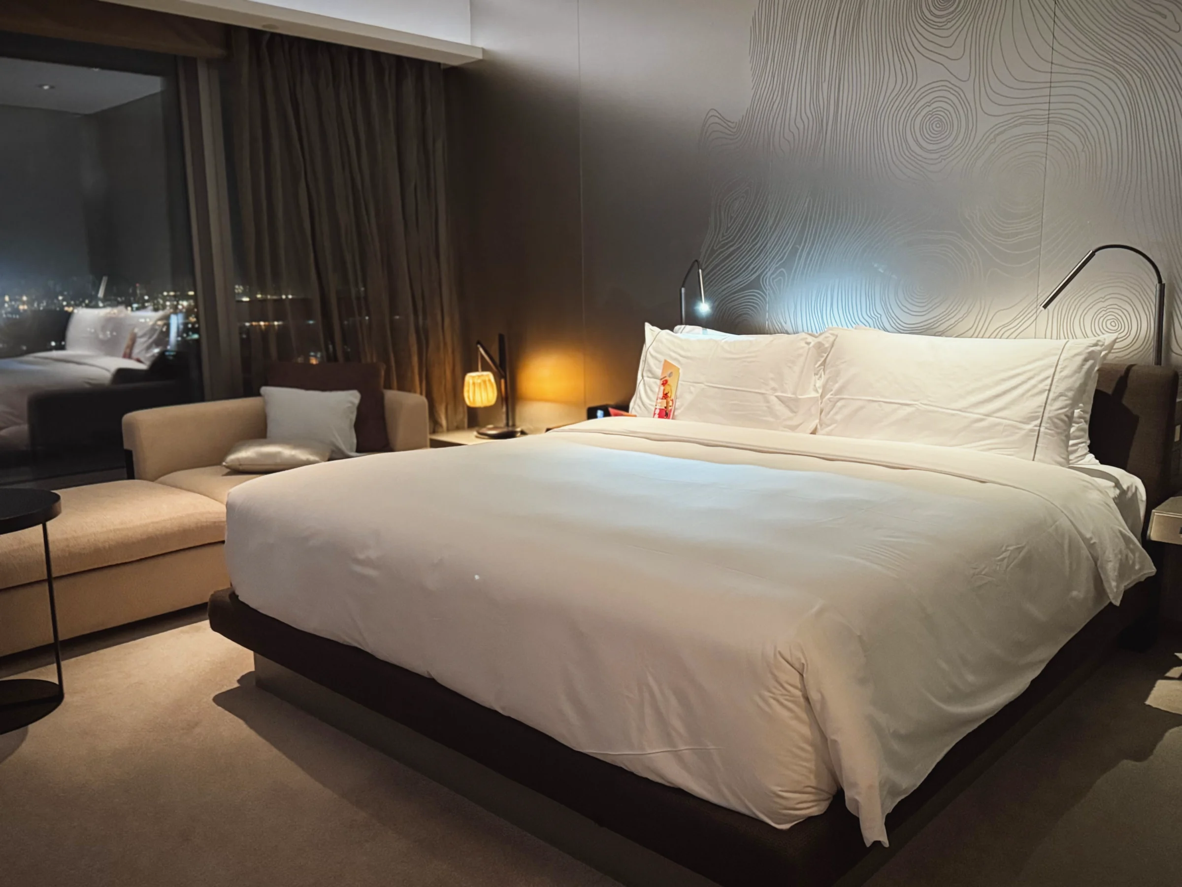 The Wonderful Room and king bed at night.