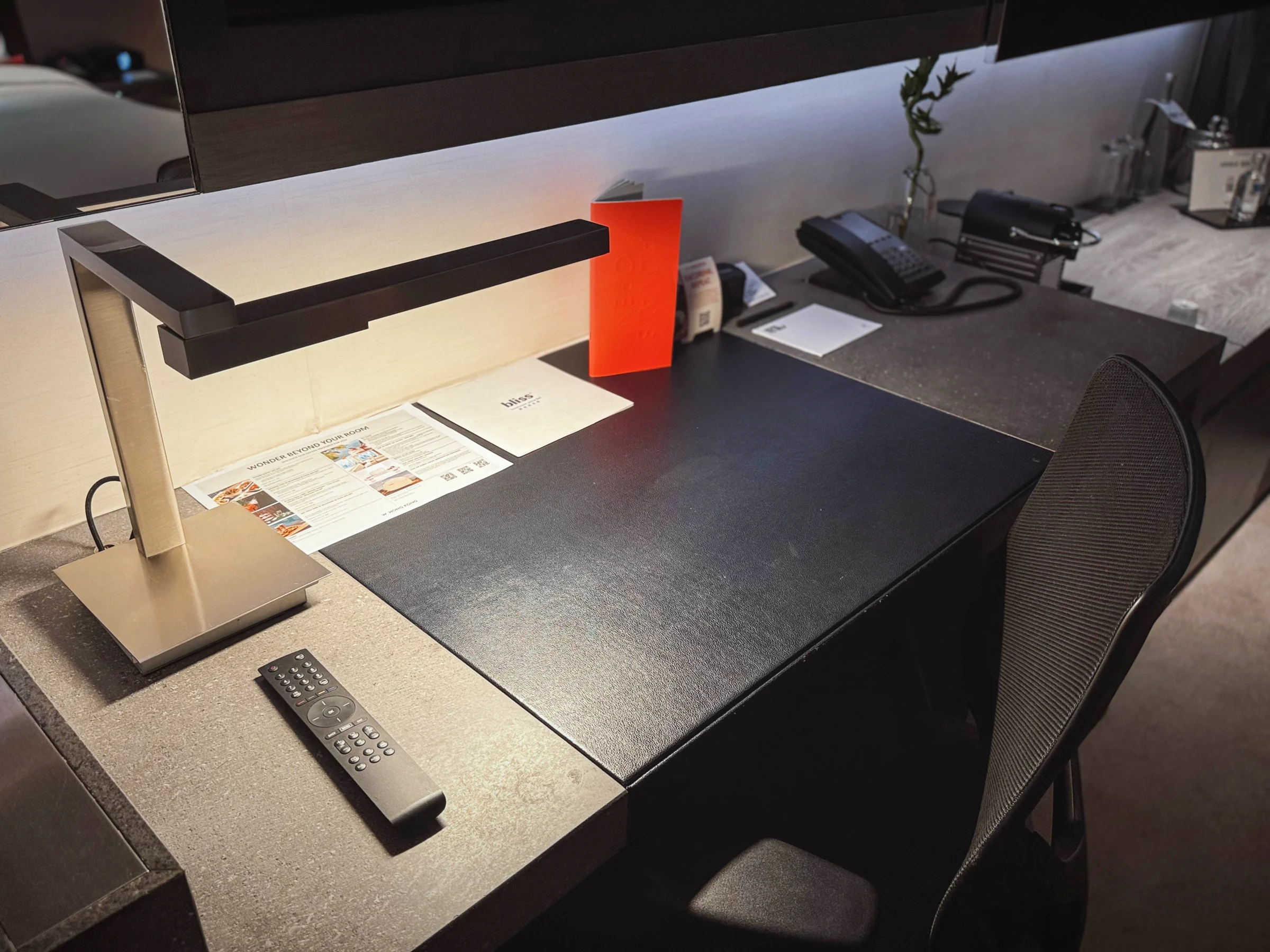 The desk by the window.