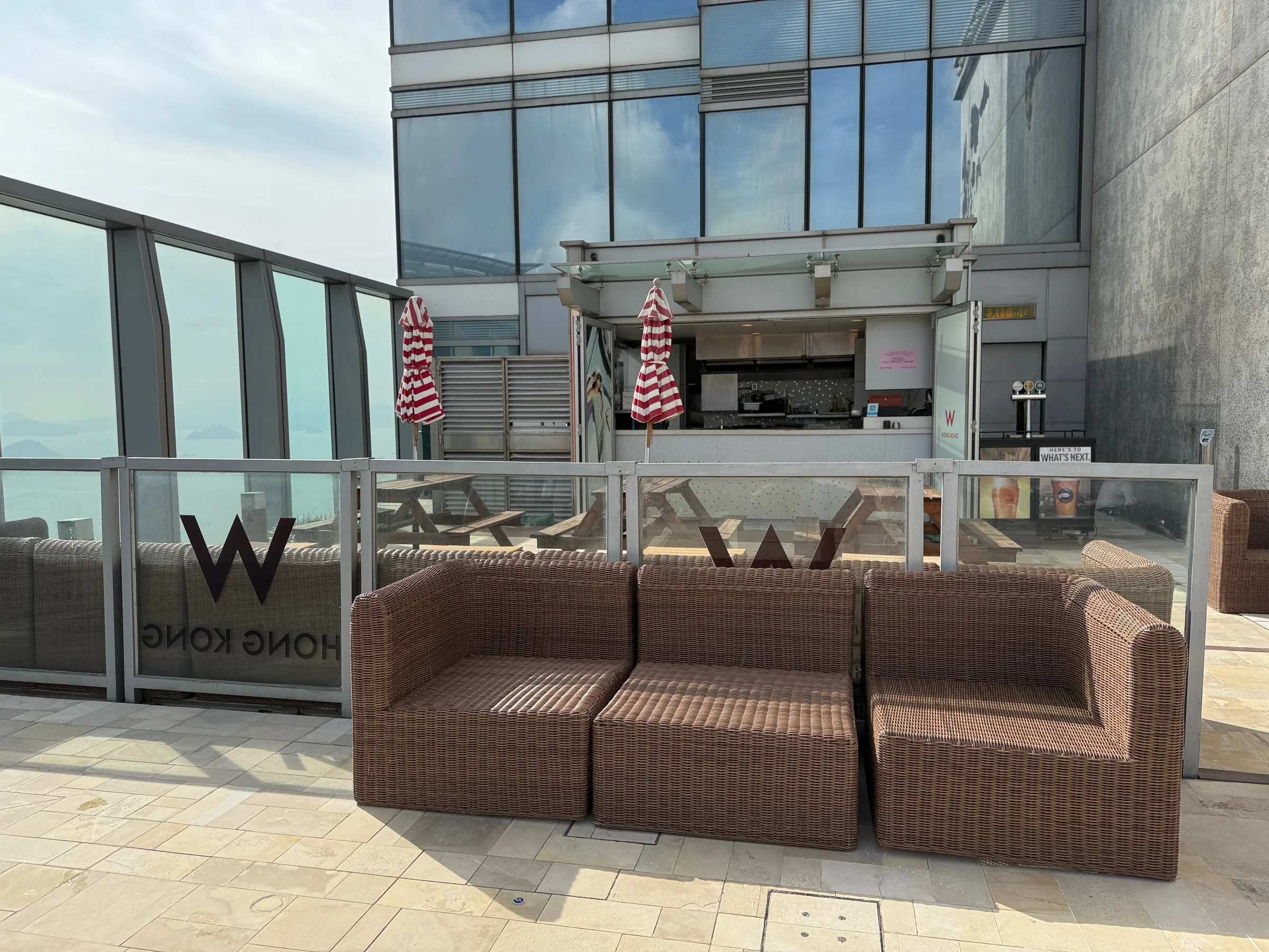 The poolside and bar in daylight.