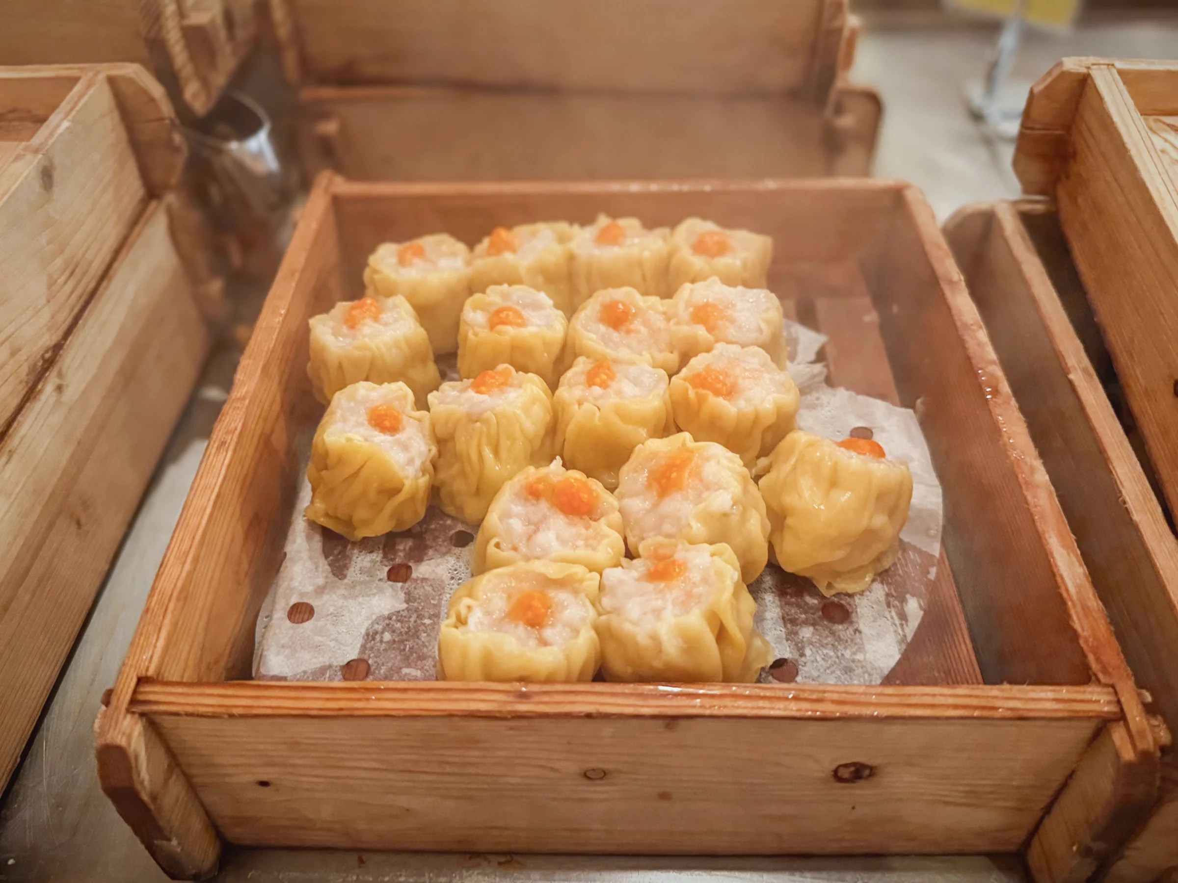 Shumai in bamboo steamers.
