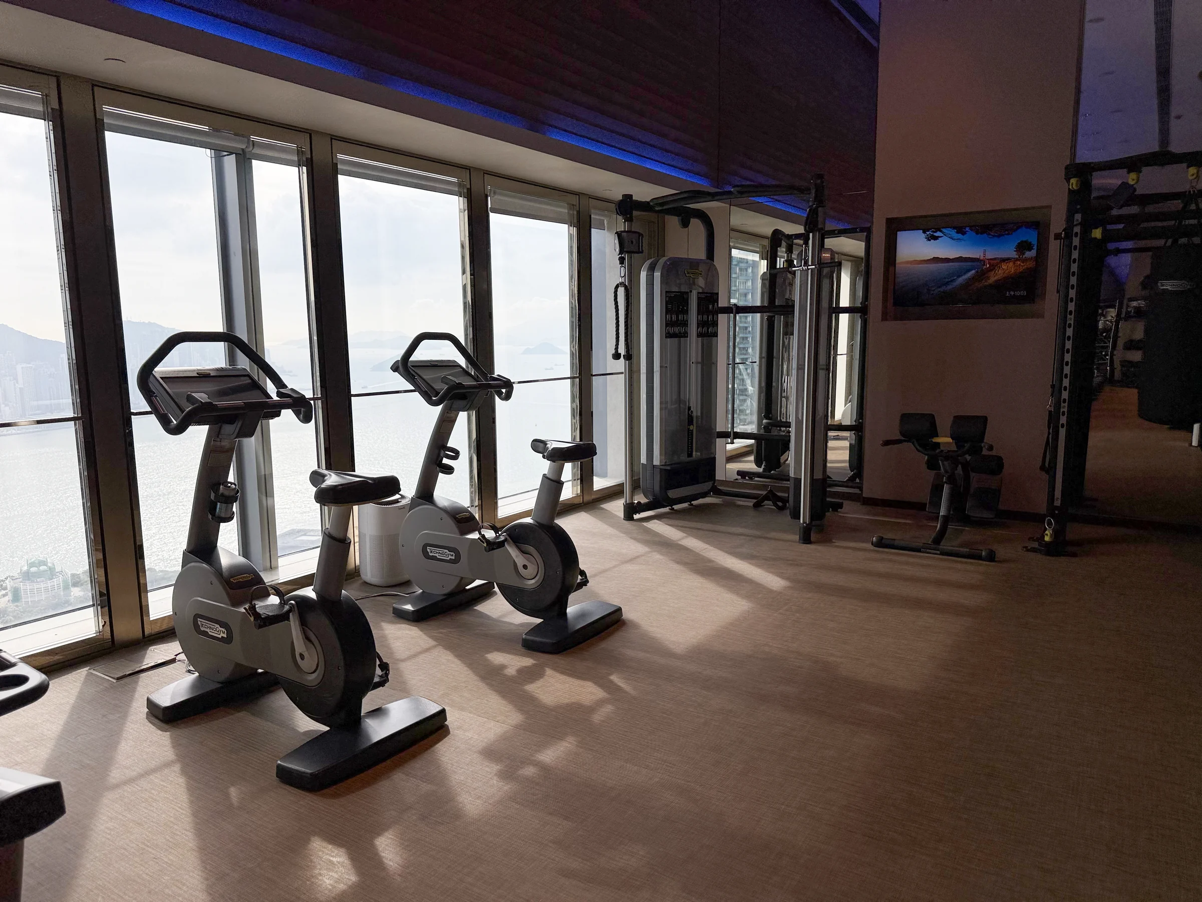Fitness machines by the window.