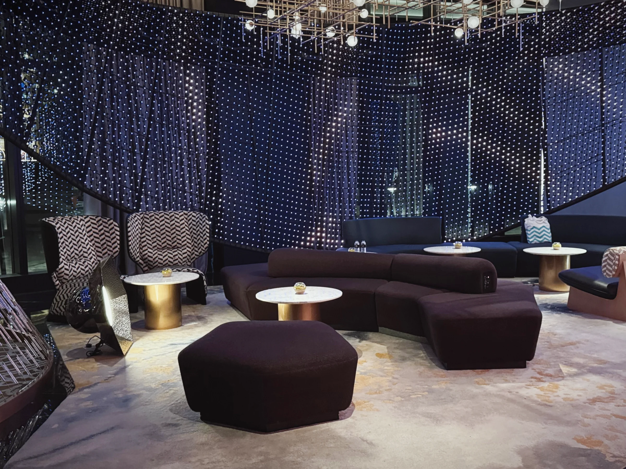 Lobby sofas surrounded by curtains of light