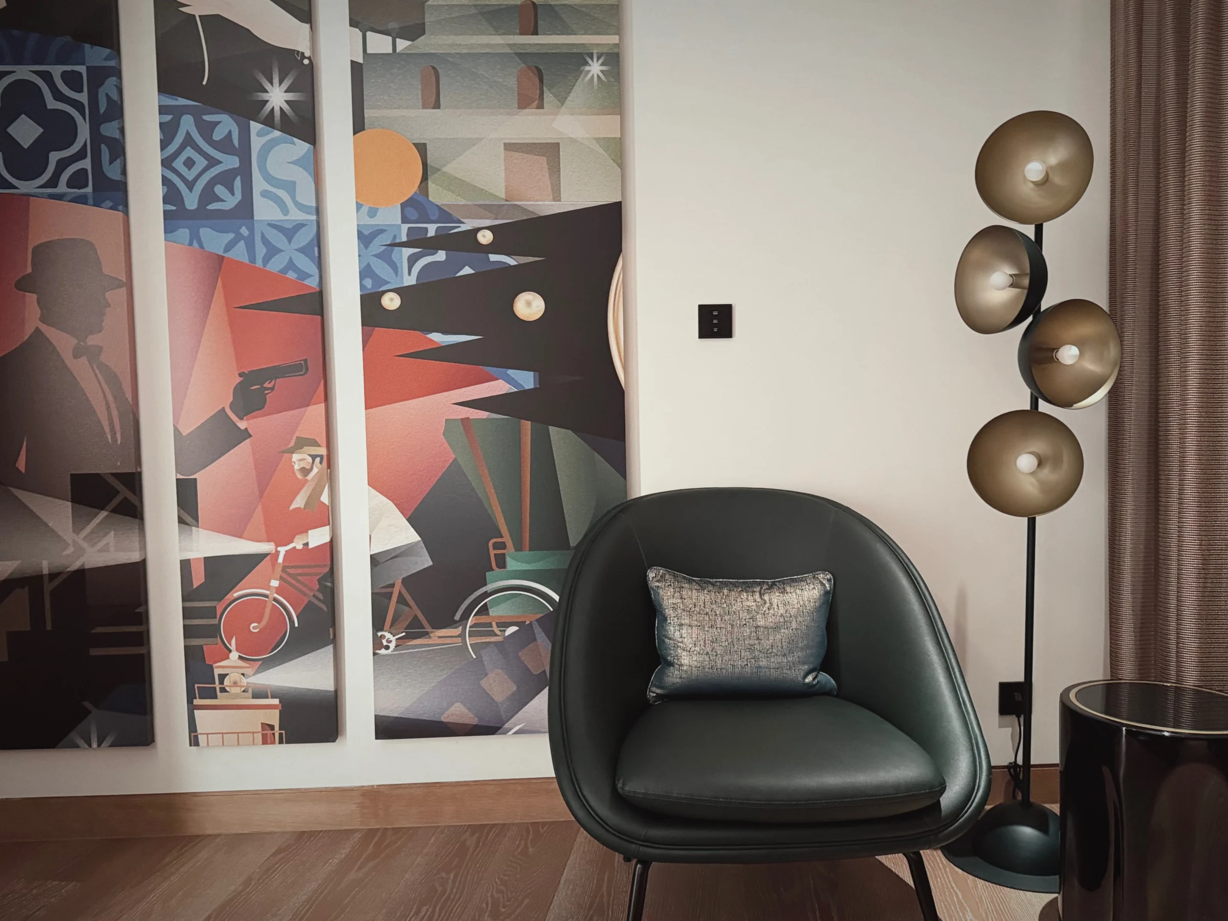 A chair and artwork in the bedroom