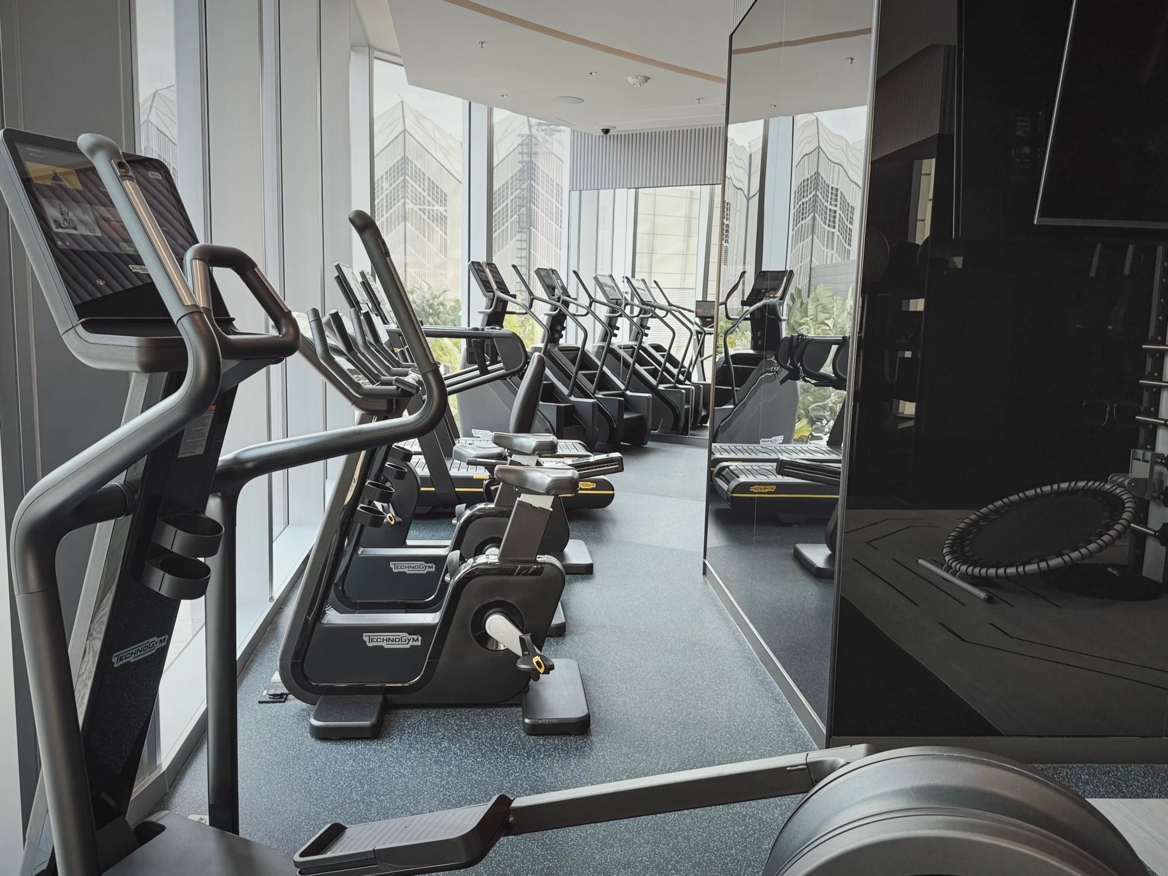 Fitness machines facing the windows