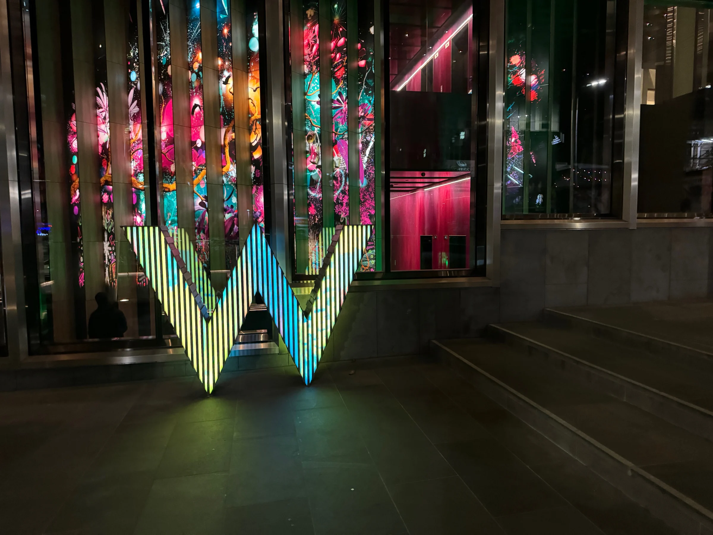 The W sign changing color at night.