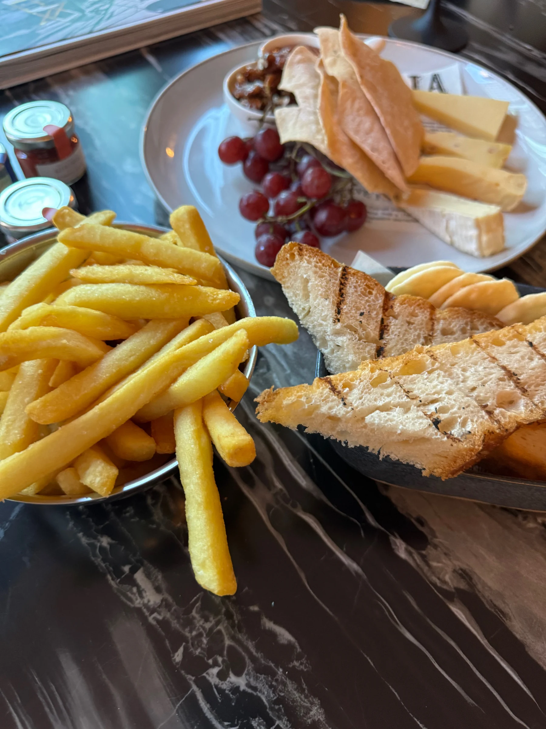 A sandwich and fries in the room.
