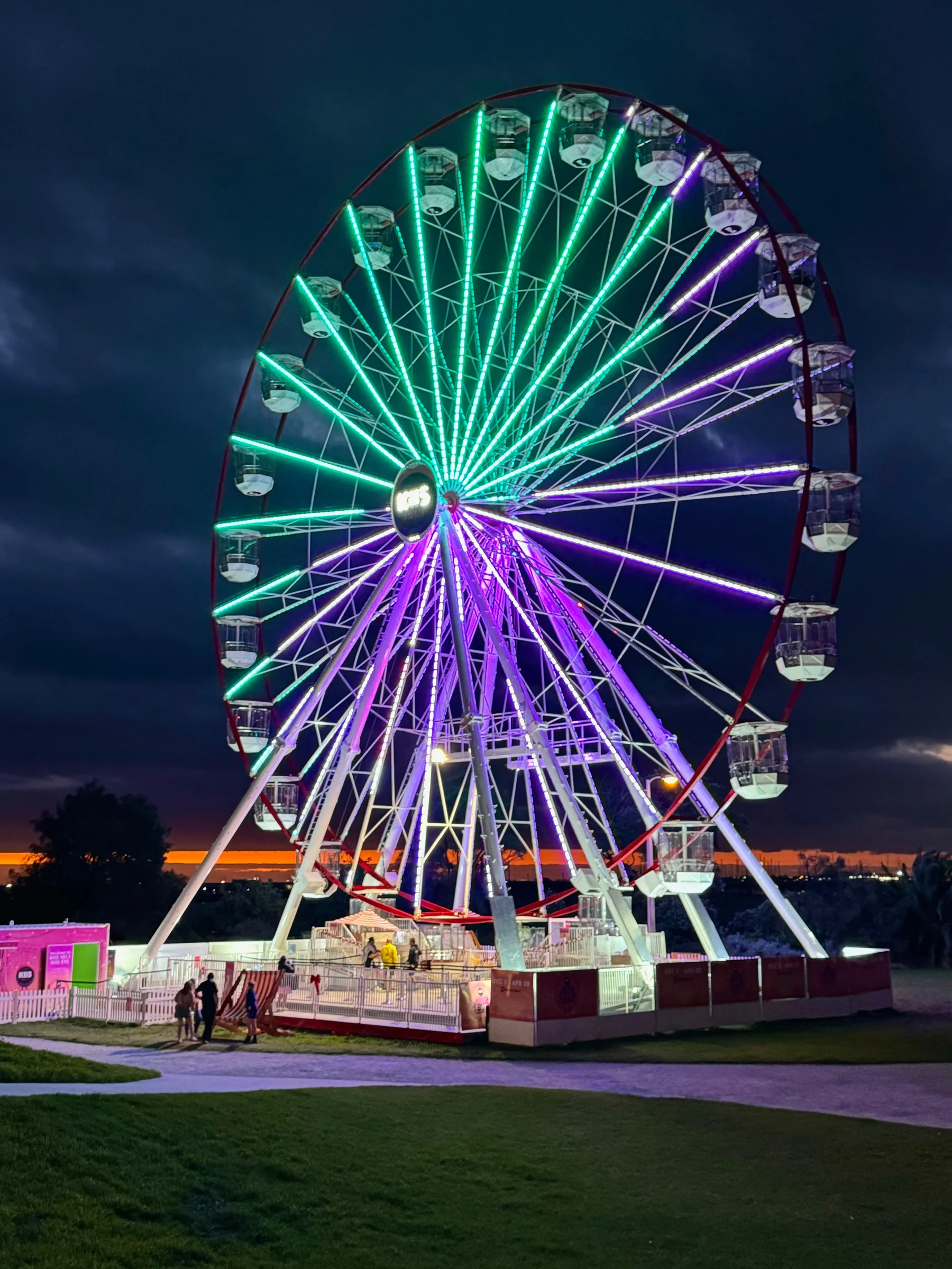 A Ferris wheel lit at night.