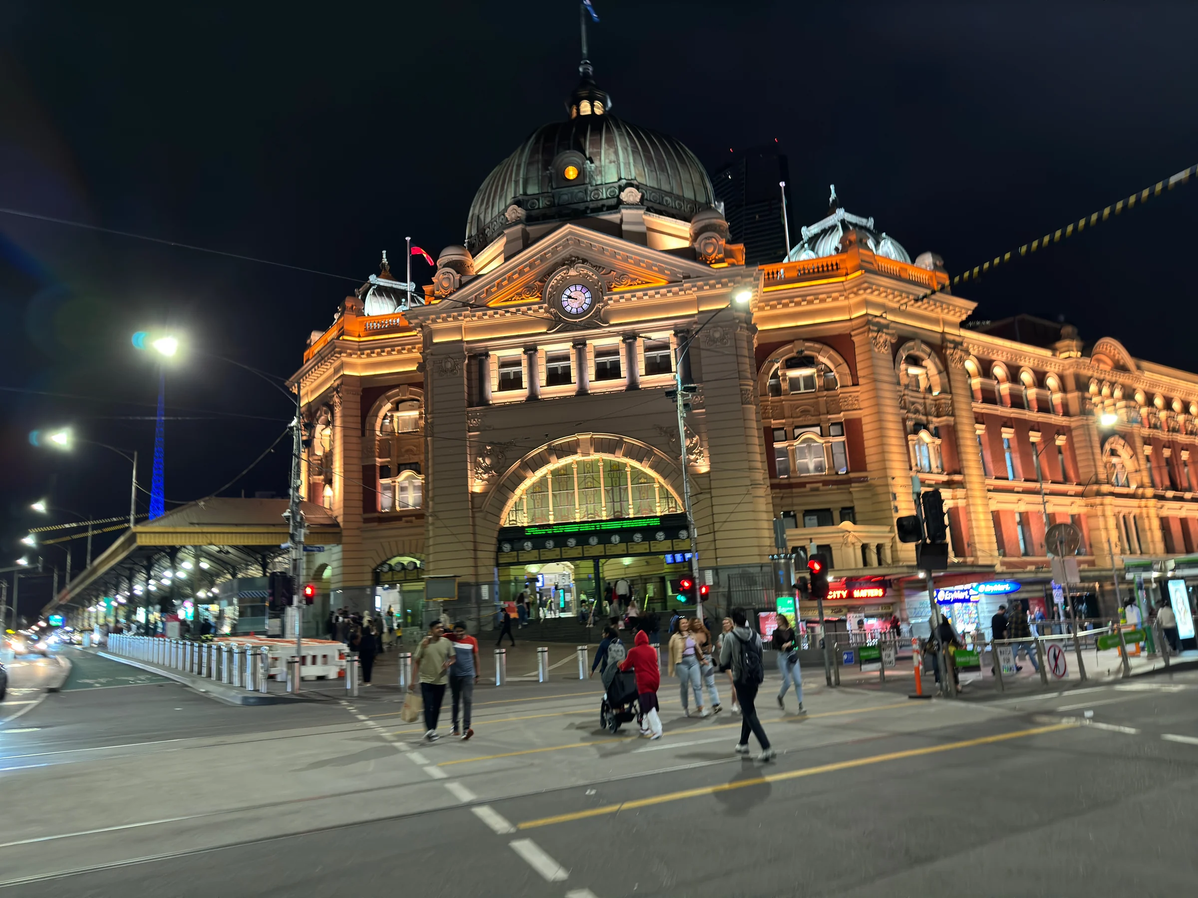 Flinders Street Station illuminated at night.