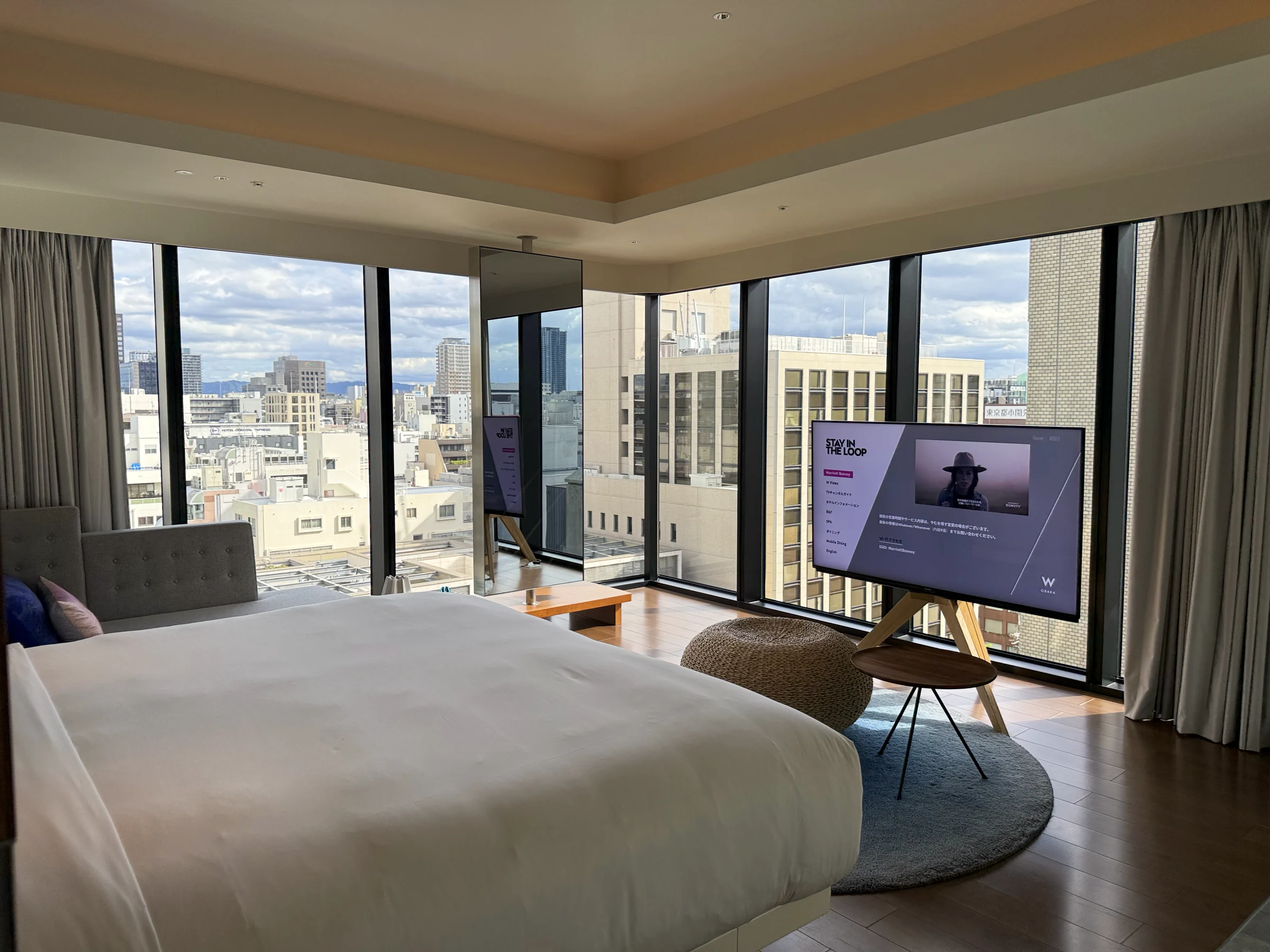 The bedroom's large windows and Midosuji view