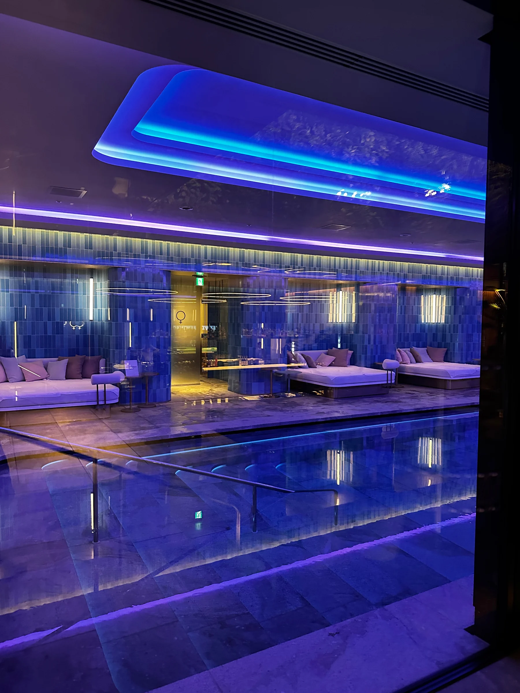 The pool in blue lighting at night. (July 2023)