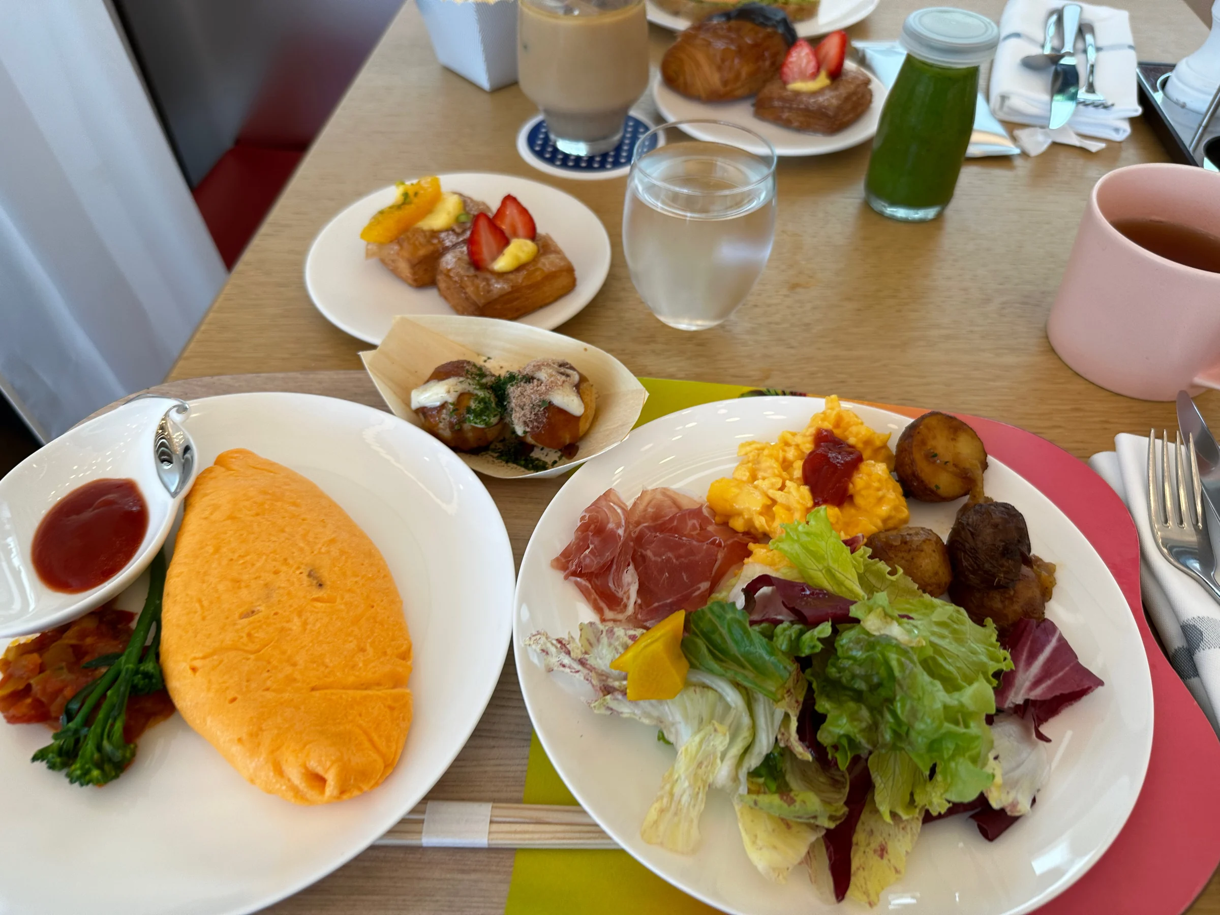 A plate with an omelet and salad. (May 2023)