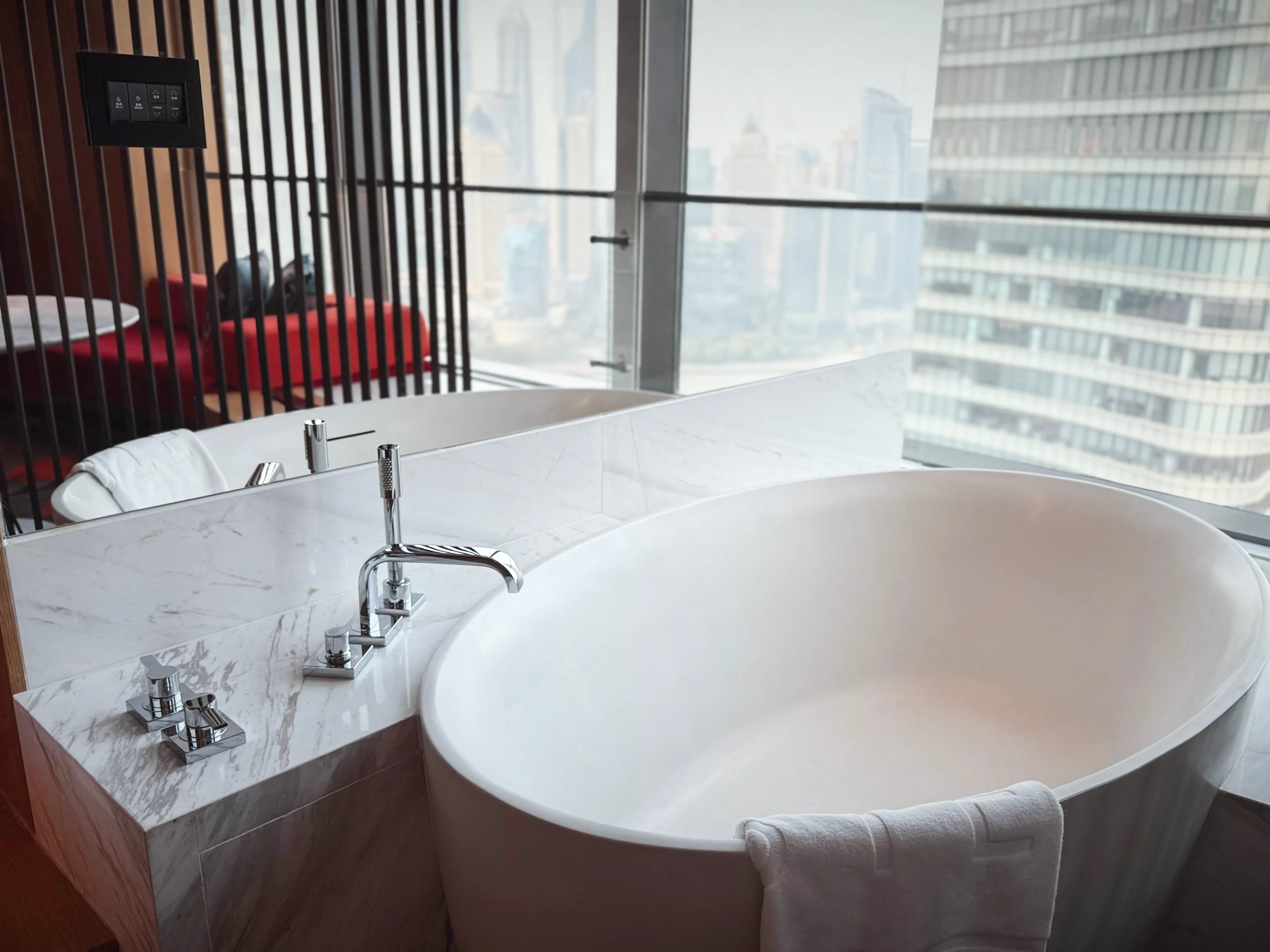 W Shanghai's window-side bathtub and Shanghai across the Huangpu River