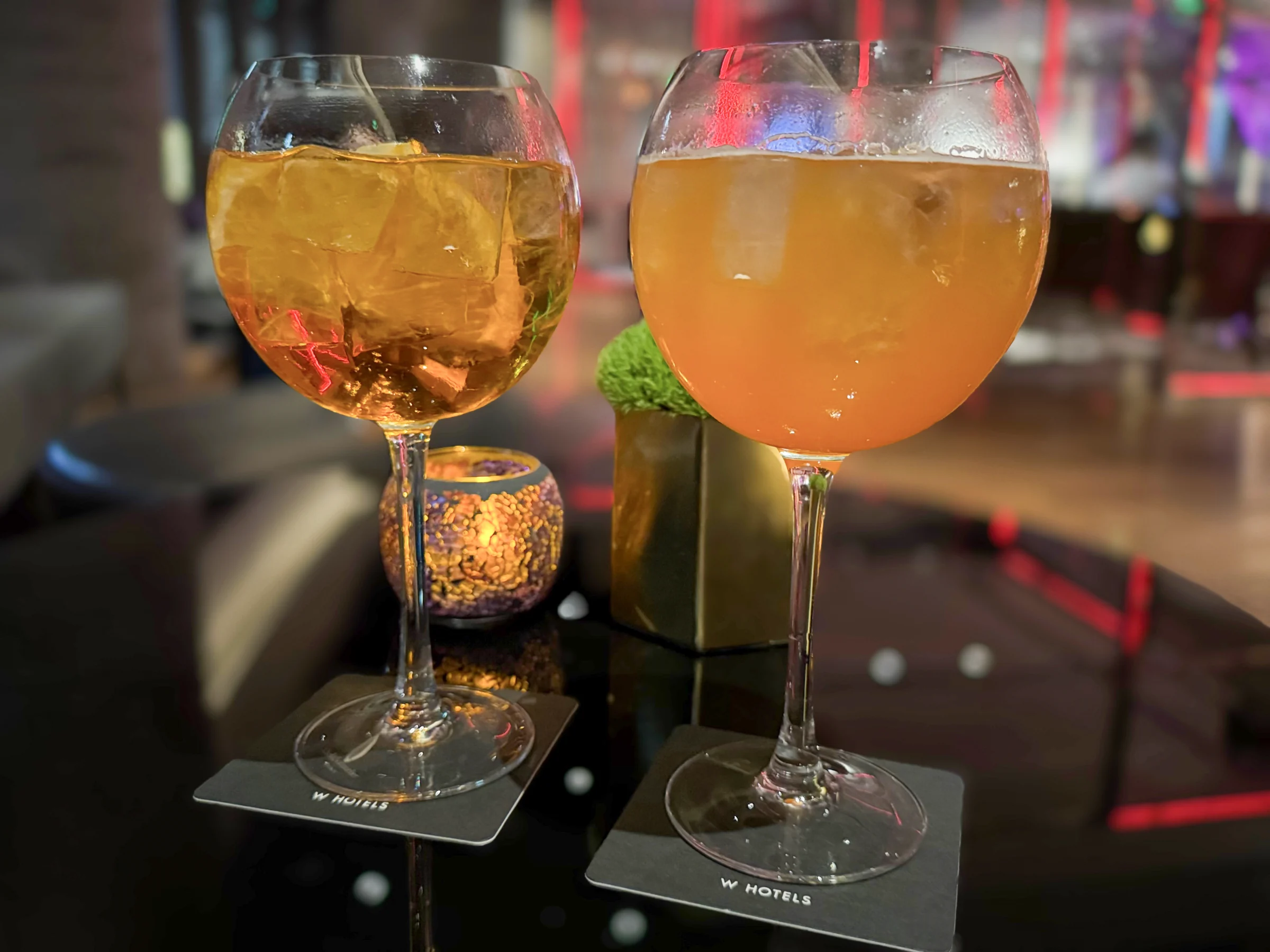 A cocktail in a large glass.