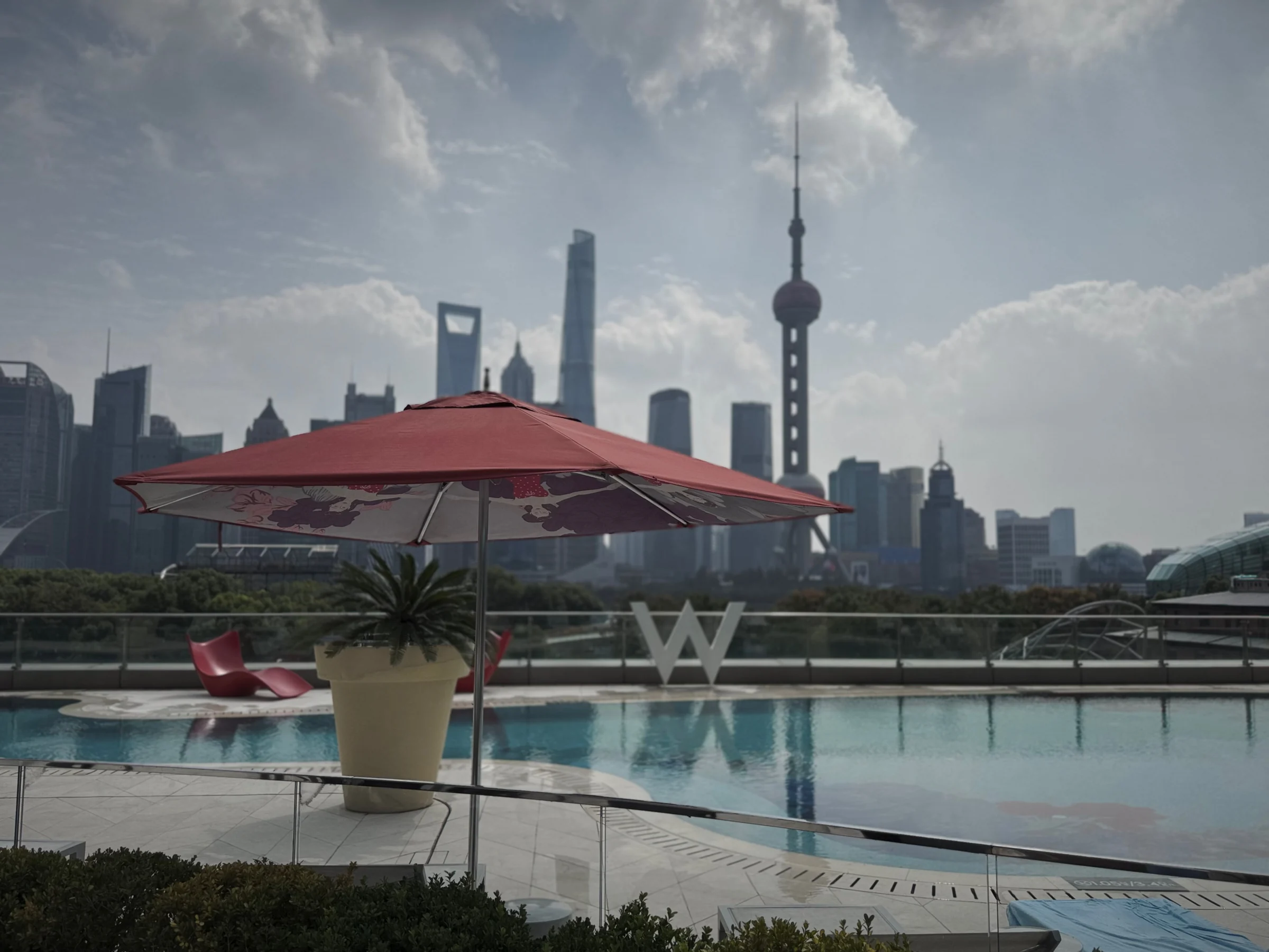 The outdoor pool and Shanghai skyline in the morning.
