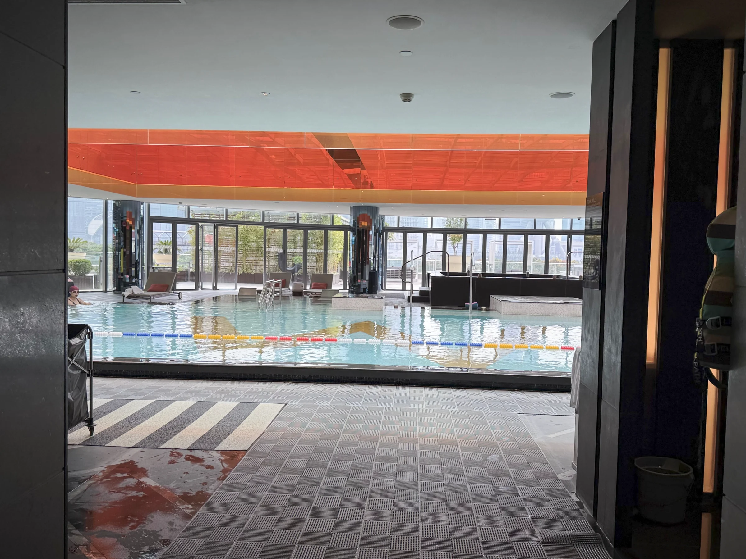 The indoor pool through the glass.