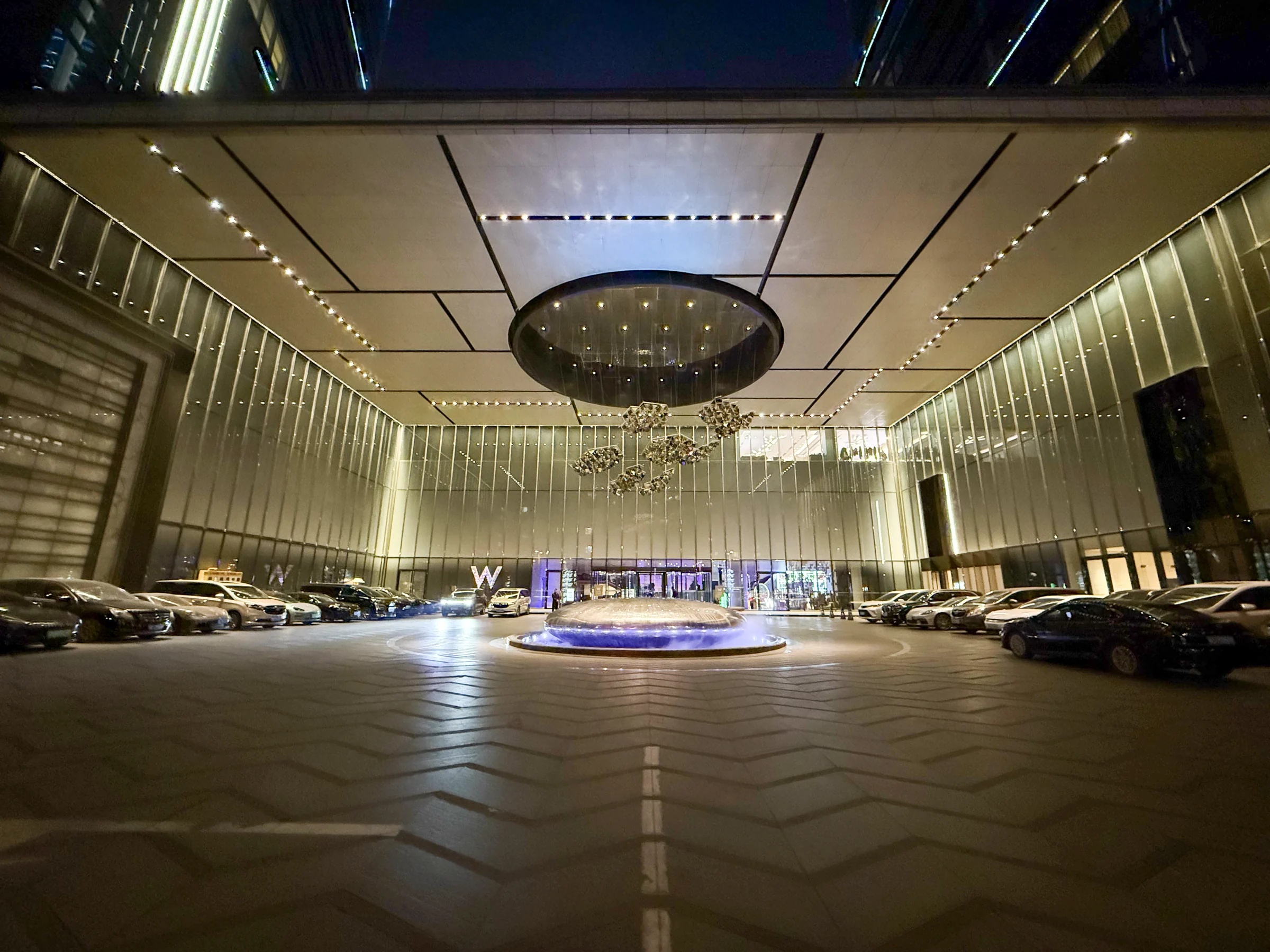 The entrance and a ring of light at night.