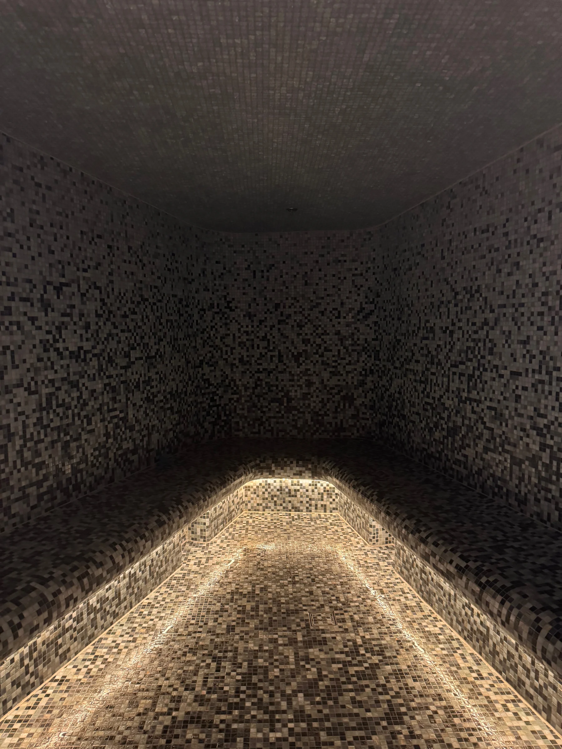 Low lighting on textured stone.
