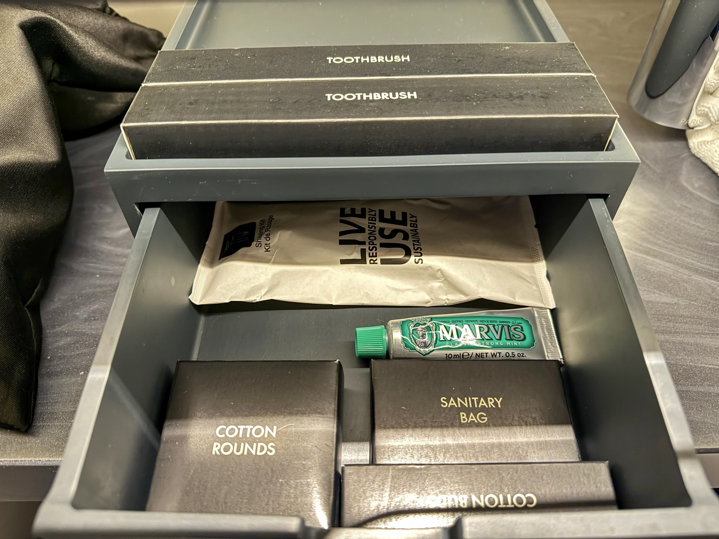 Amenities including wooden toothbrushes.
