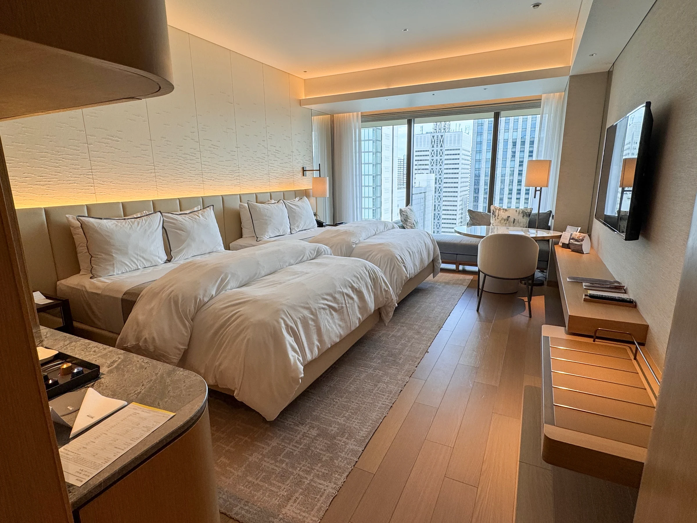 The Deluxe Double at The Westin Yokohama, with two beds and a sofa by the window