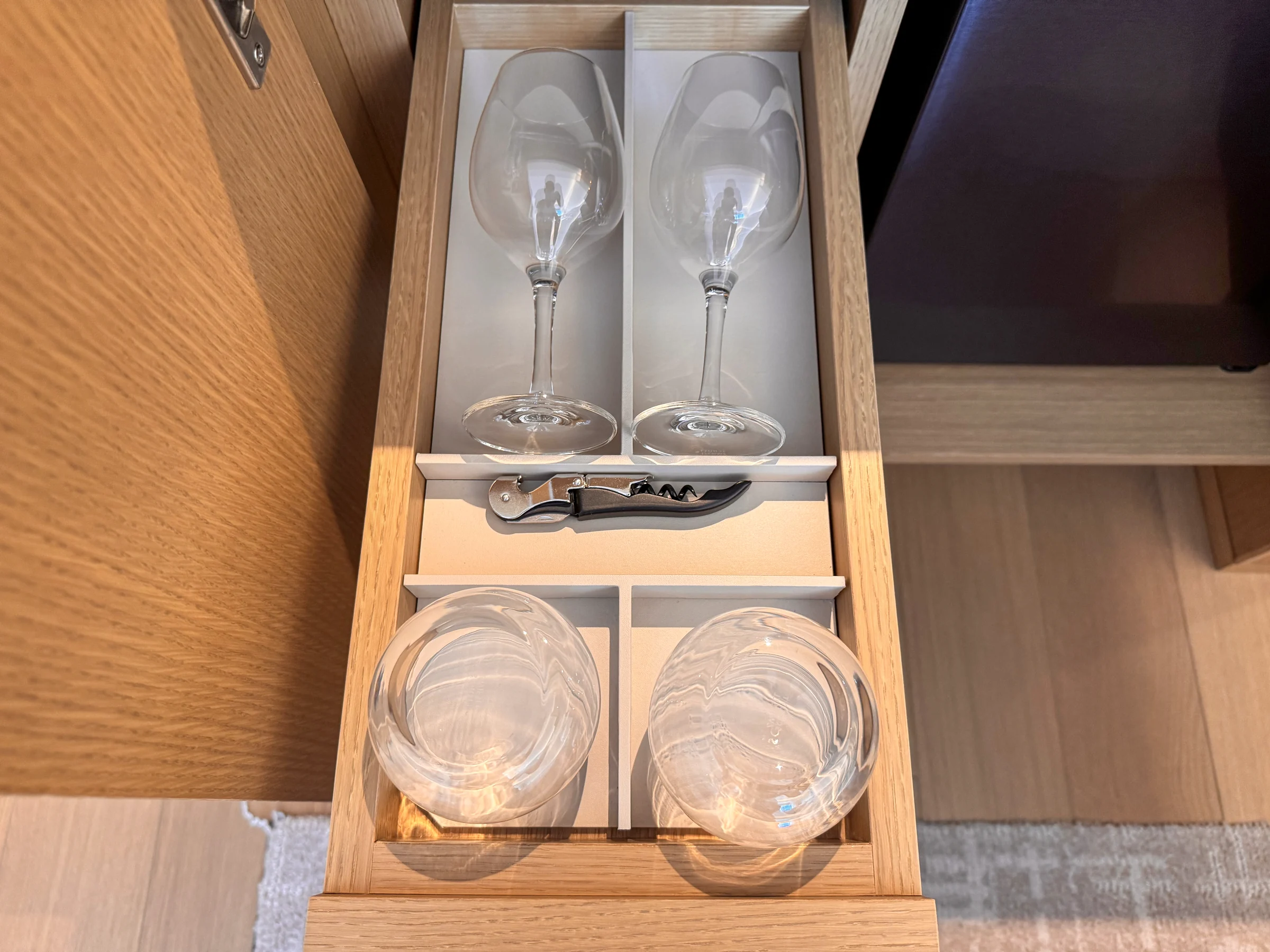 Glasses and cups stored in a drawer