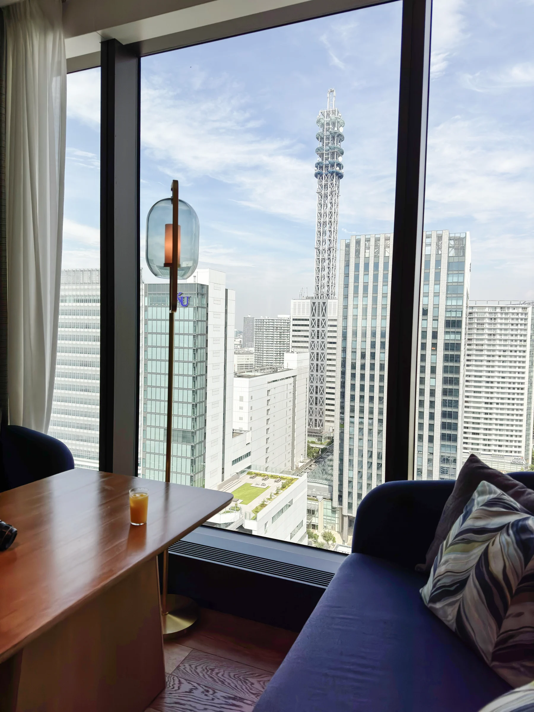 Lounge seating overlooking the city through large windows